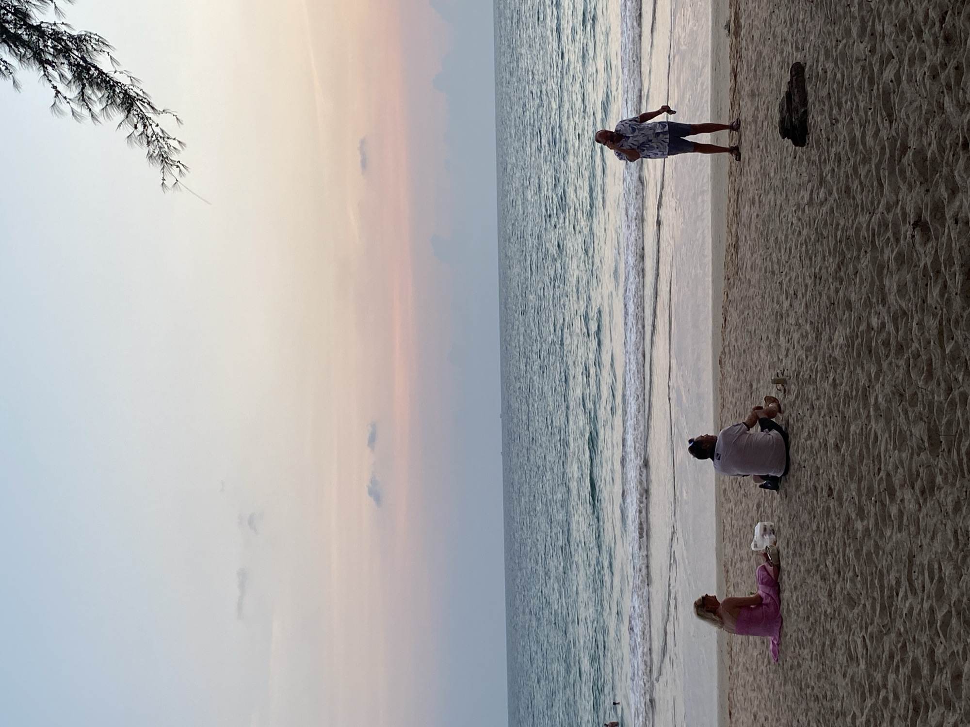 Sunset beach gathering captured in Choeng Thale, Thailand