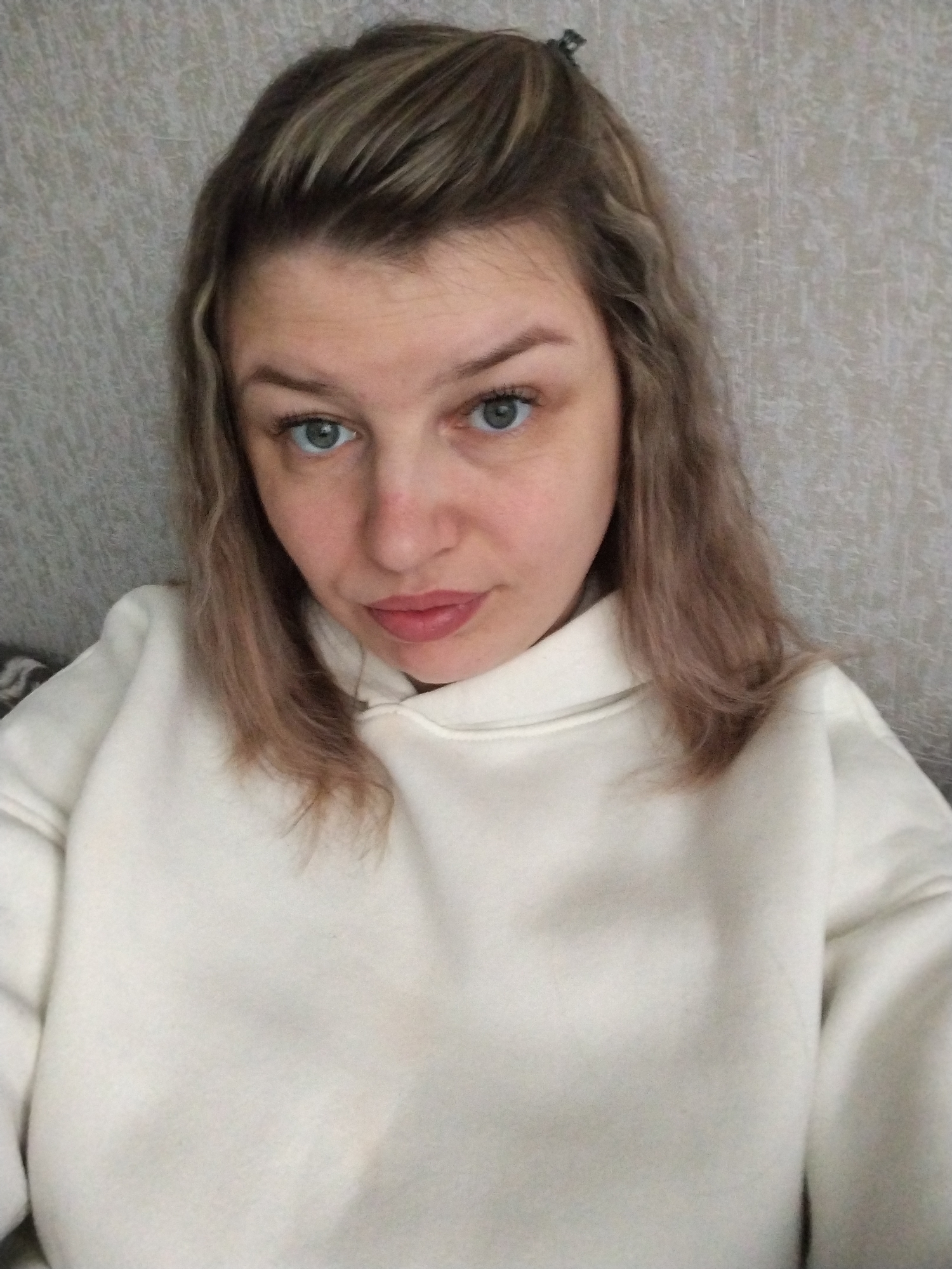 Woman in white hoodie photographed indoors in Yaroslavl