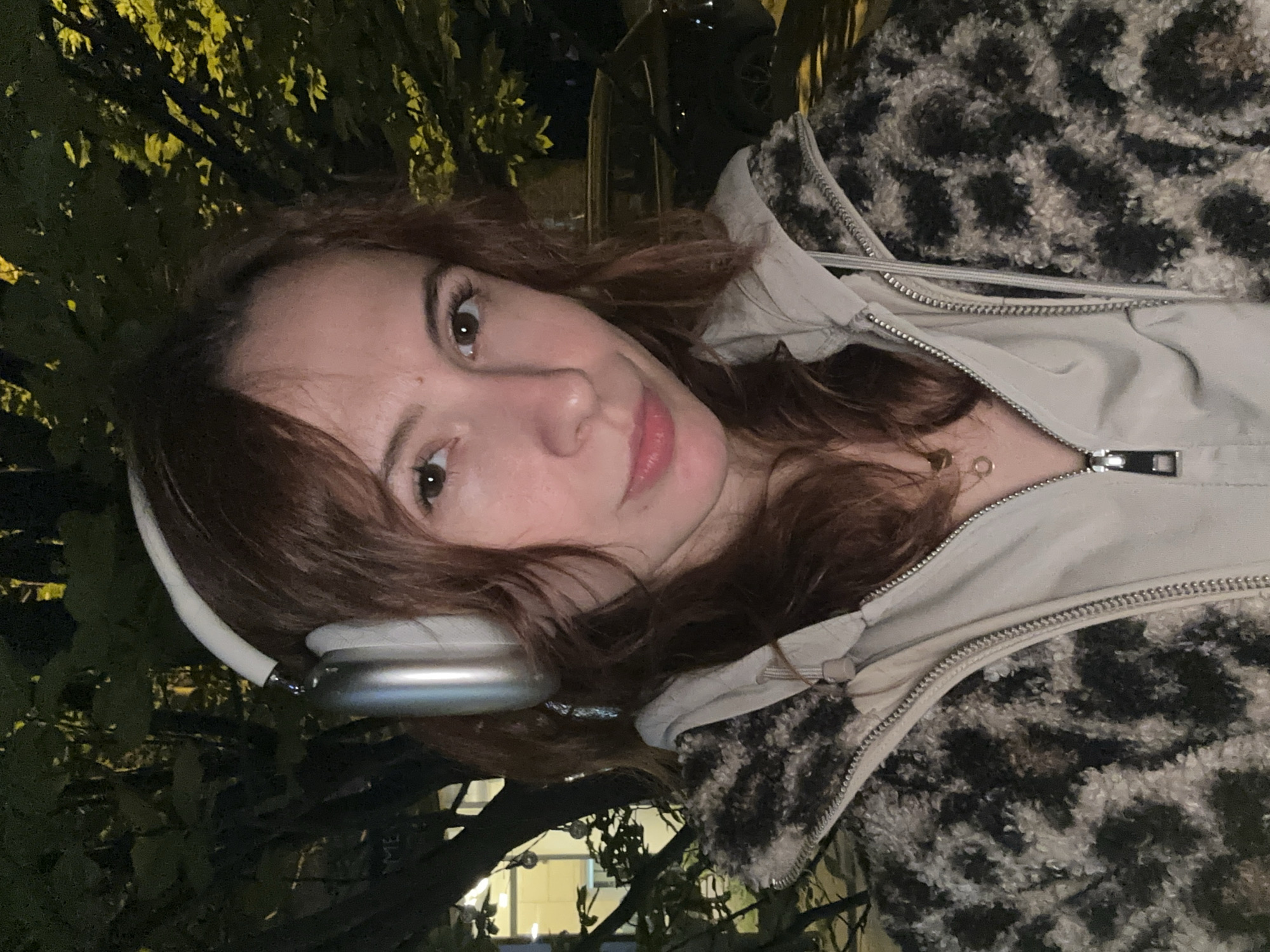 Young woman takes evening selfies in Novi Sad, Serbia