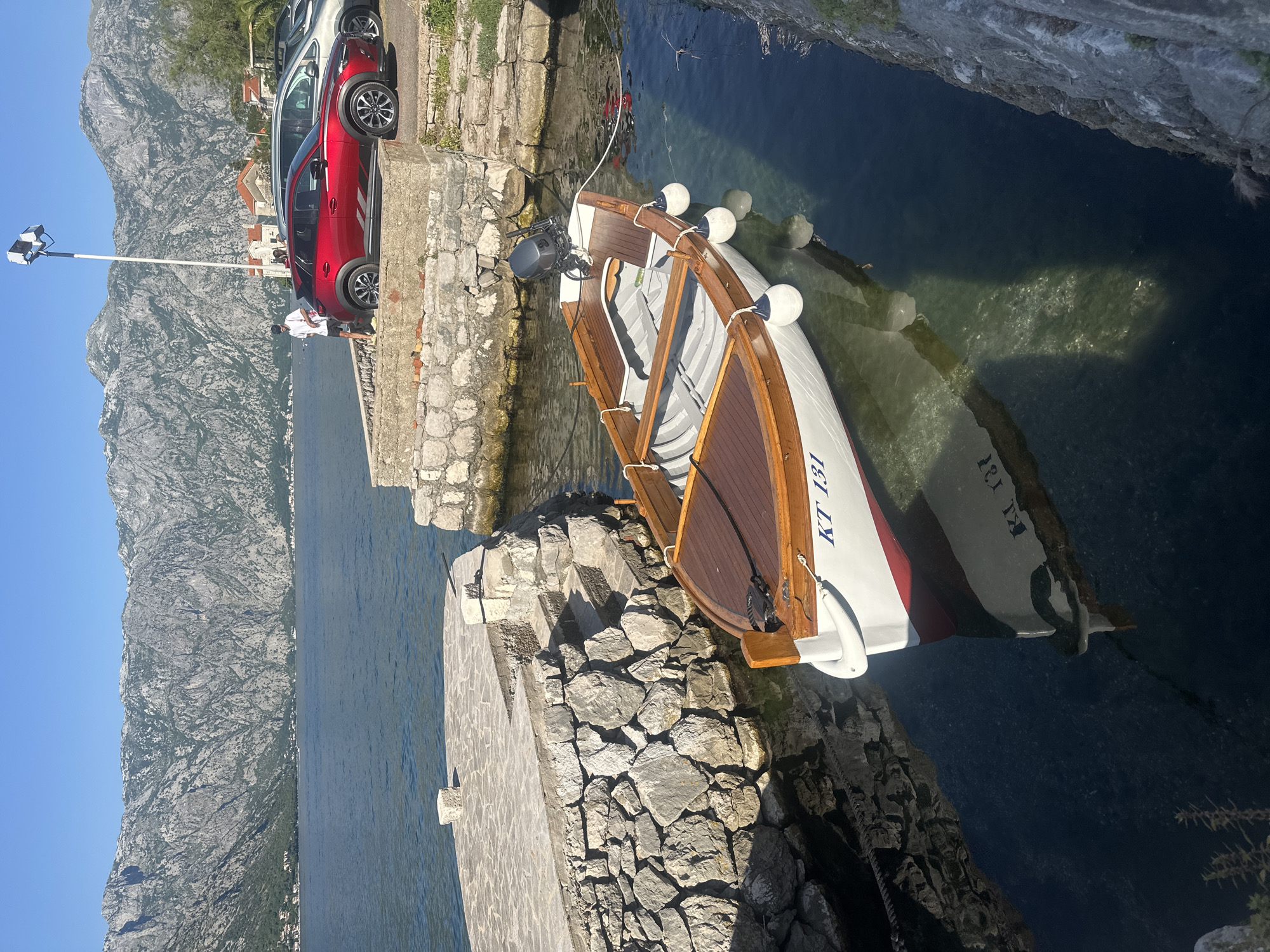 Clear afternoon captures Bay of Kotor's historic waterfront life
