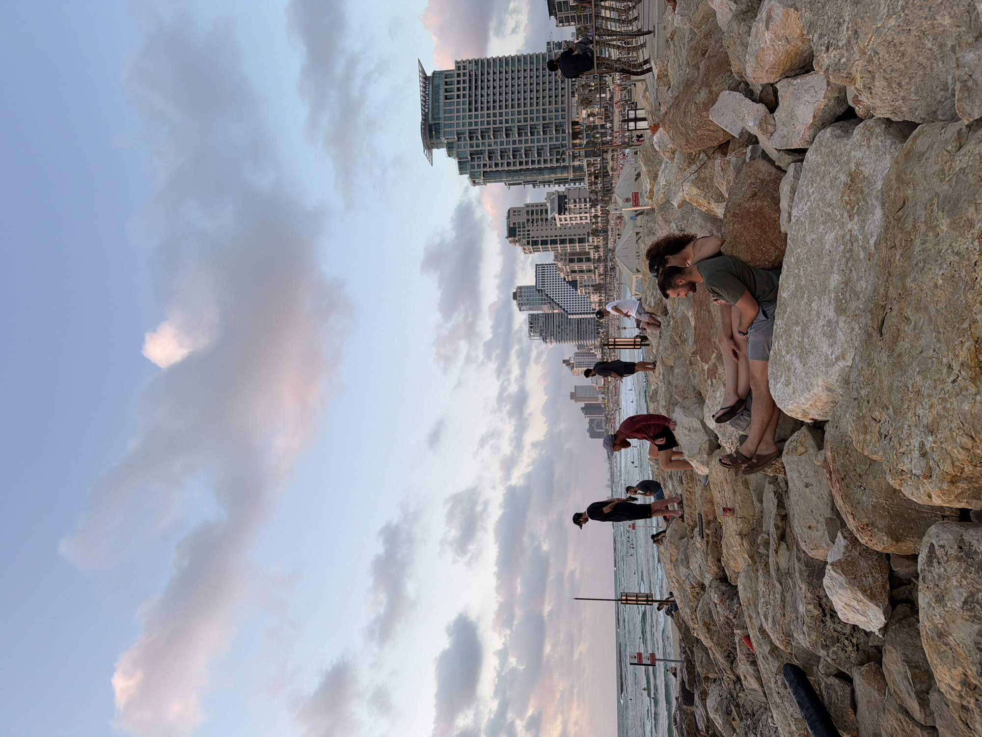 Rocky Tel Aviv shoreline, late afternoon to evening hangout