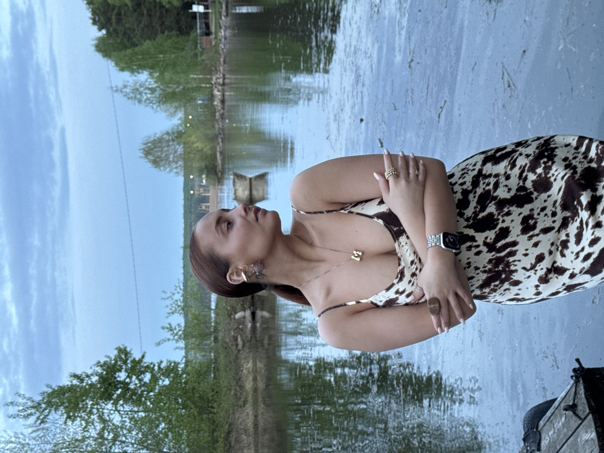Waterfront moments captured in Chaikovsky: woman poses, child watches duck