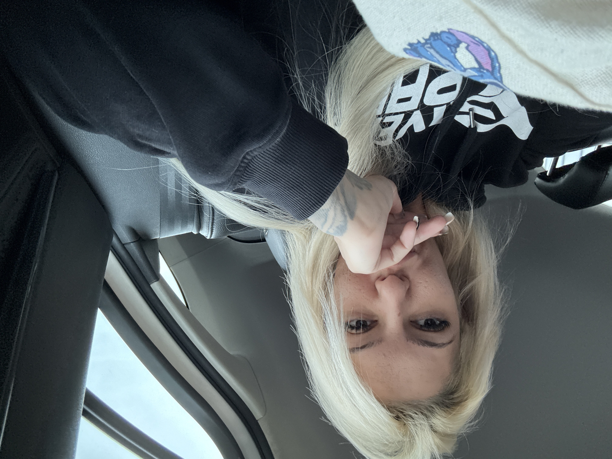 Woman with teddy bear observed waiting in car