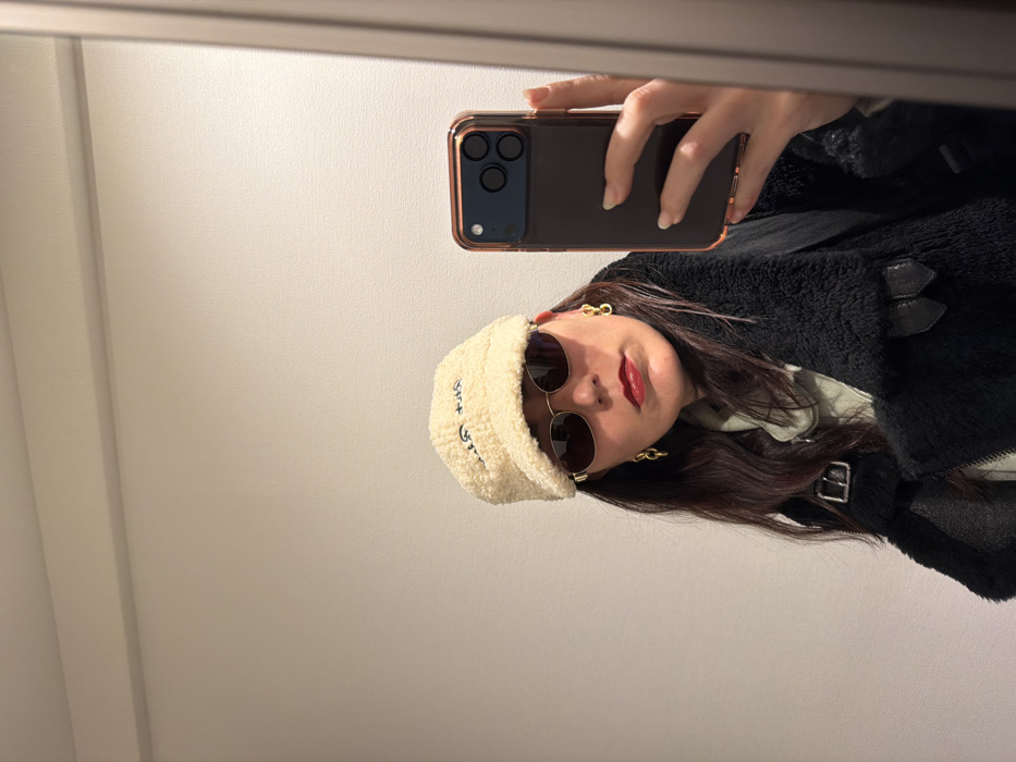 Person takes late-night selfie in fashionable outfit in Shibuya