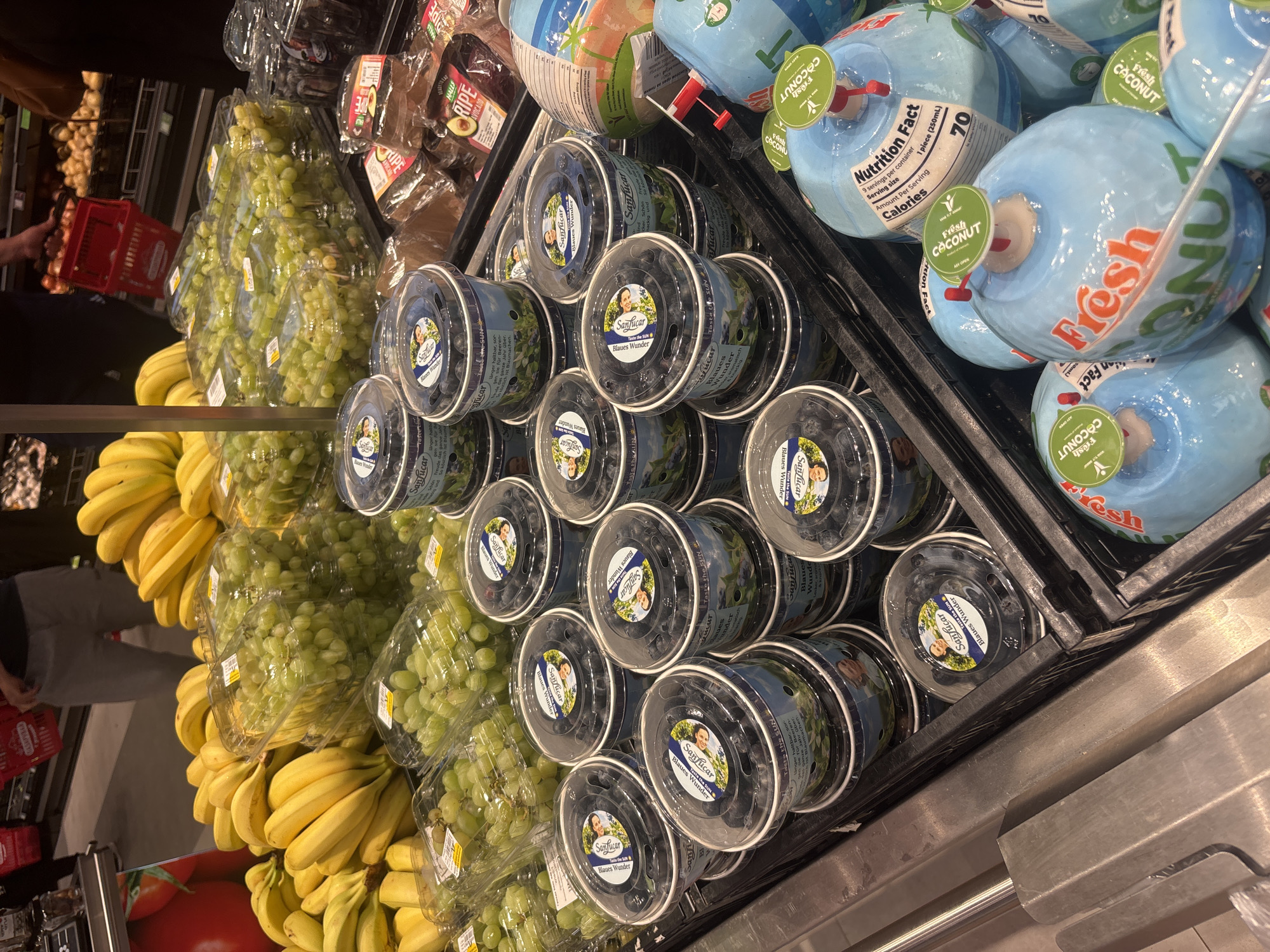 Shopper documents fresh produce displays at Plovdiv grocery store