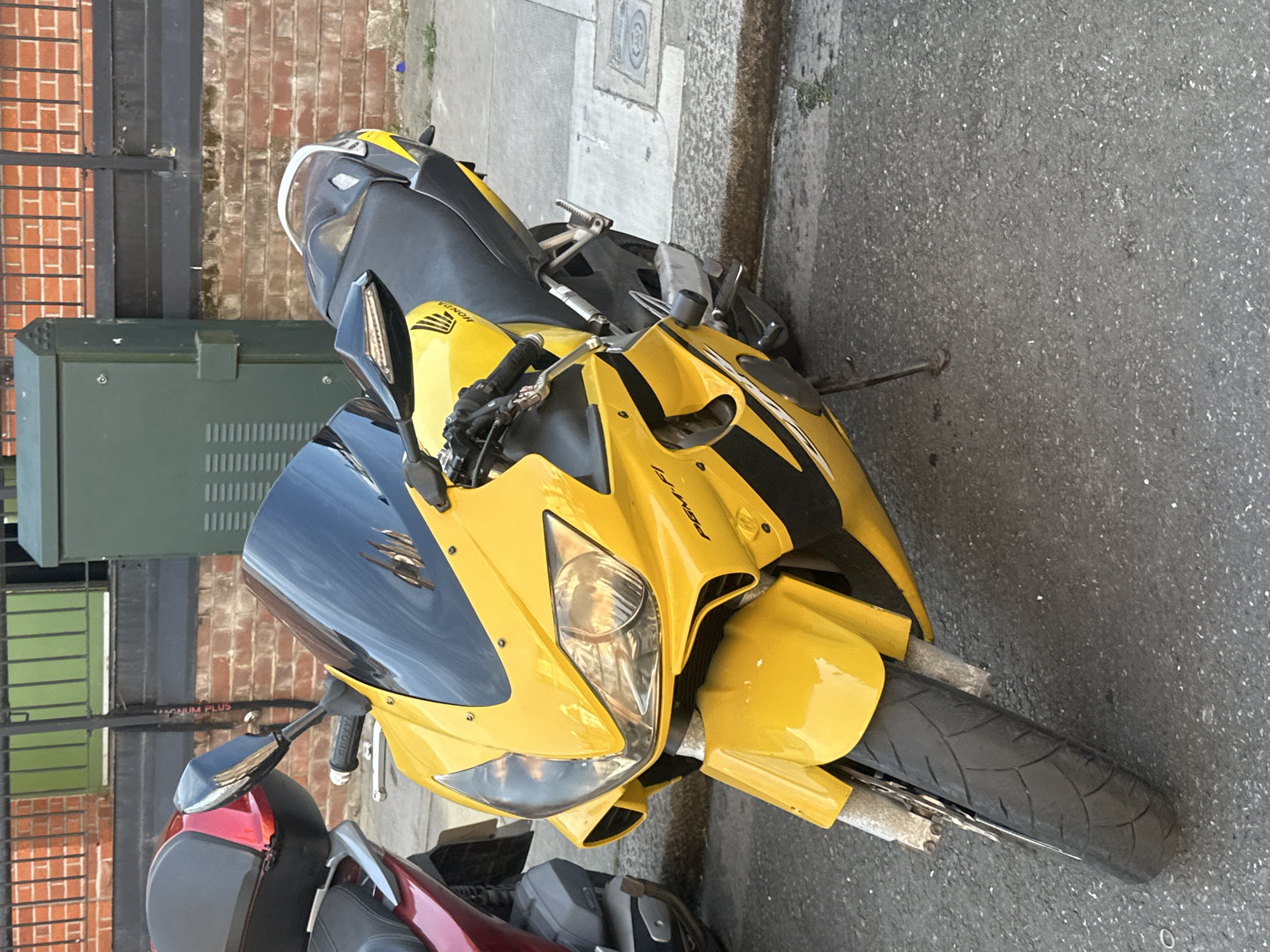 London street scenes documented: motorcycle, terraced houses, bulletin board