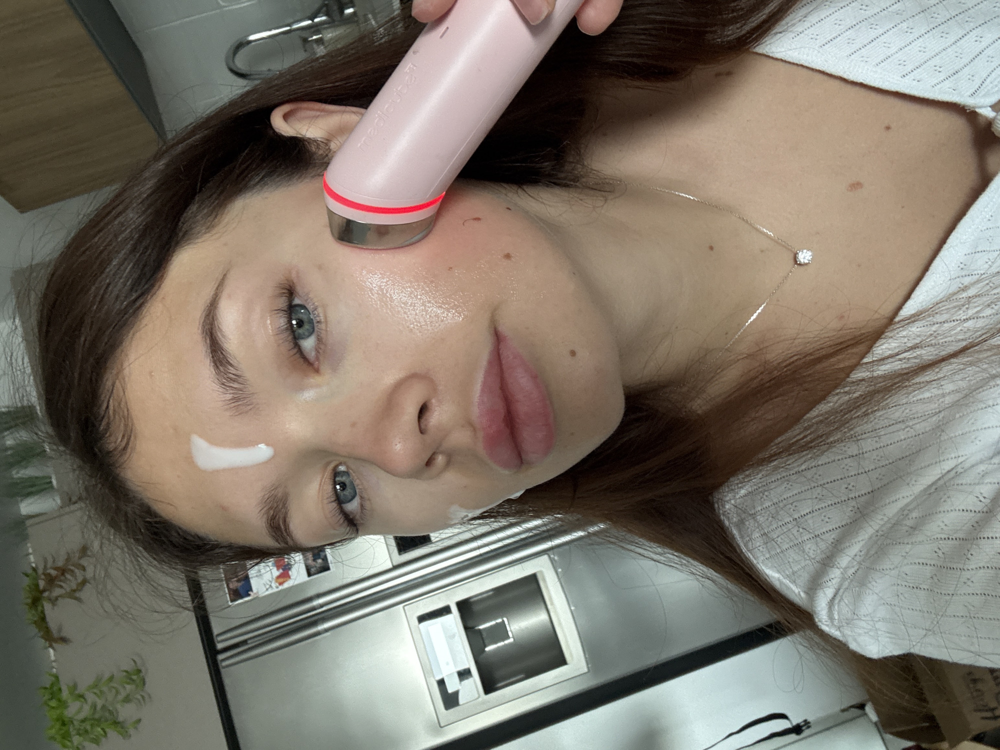 Woman performs morning skincare routine in Givatayim