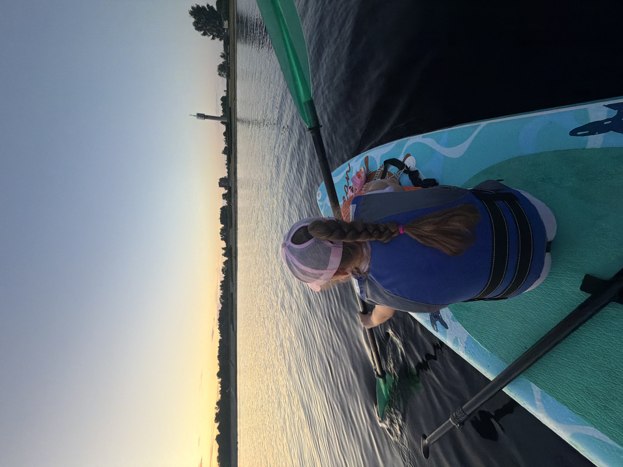 Sunset paddleboarding session on the Daugava River, Latvia