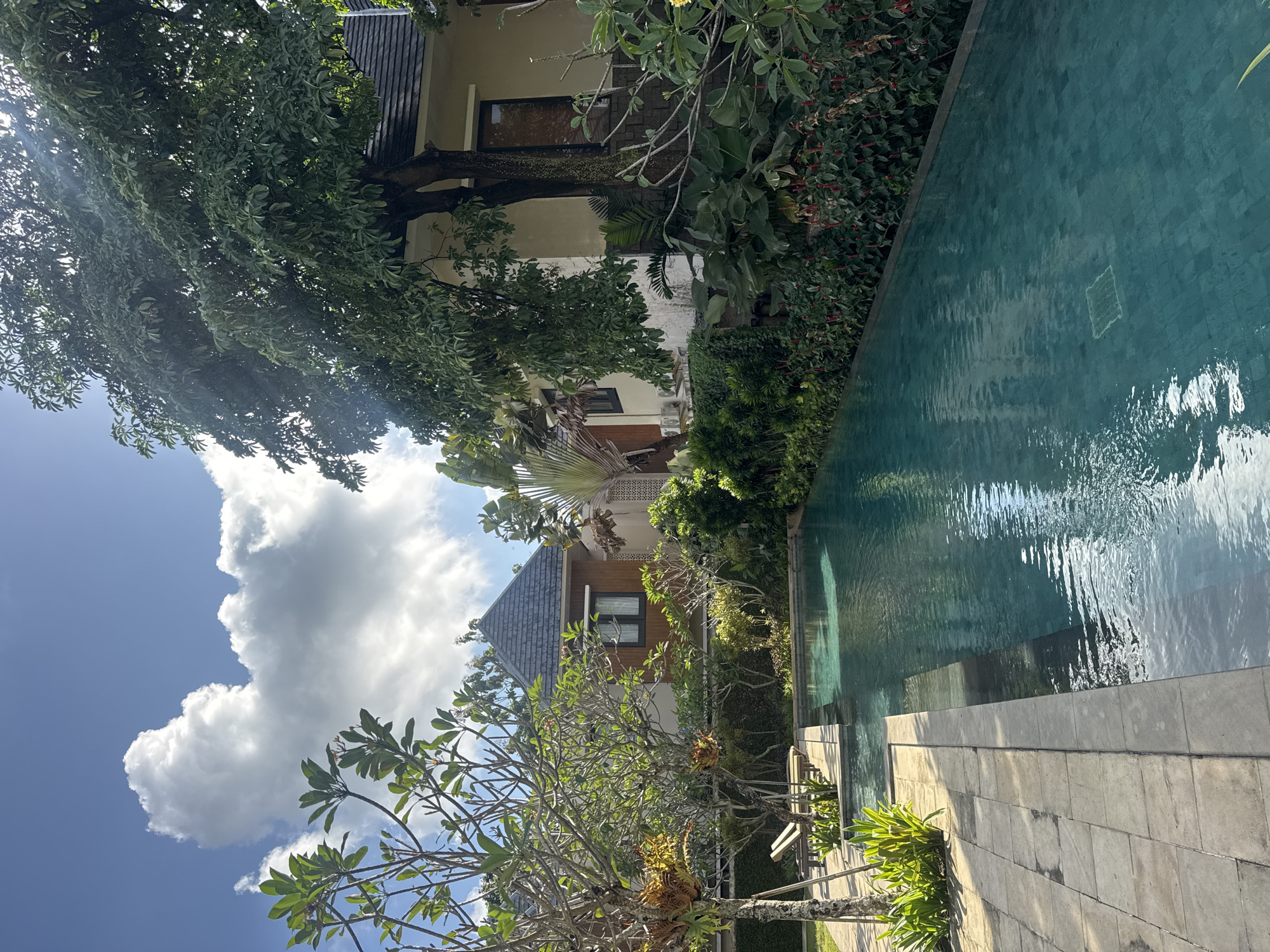 Exploring a lush Bali resort: pools, pathways, and tropical flowers