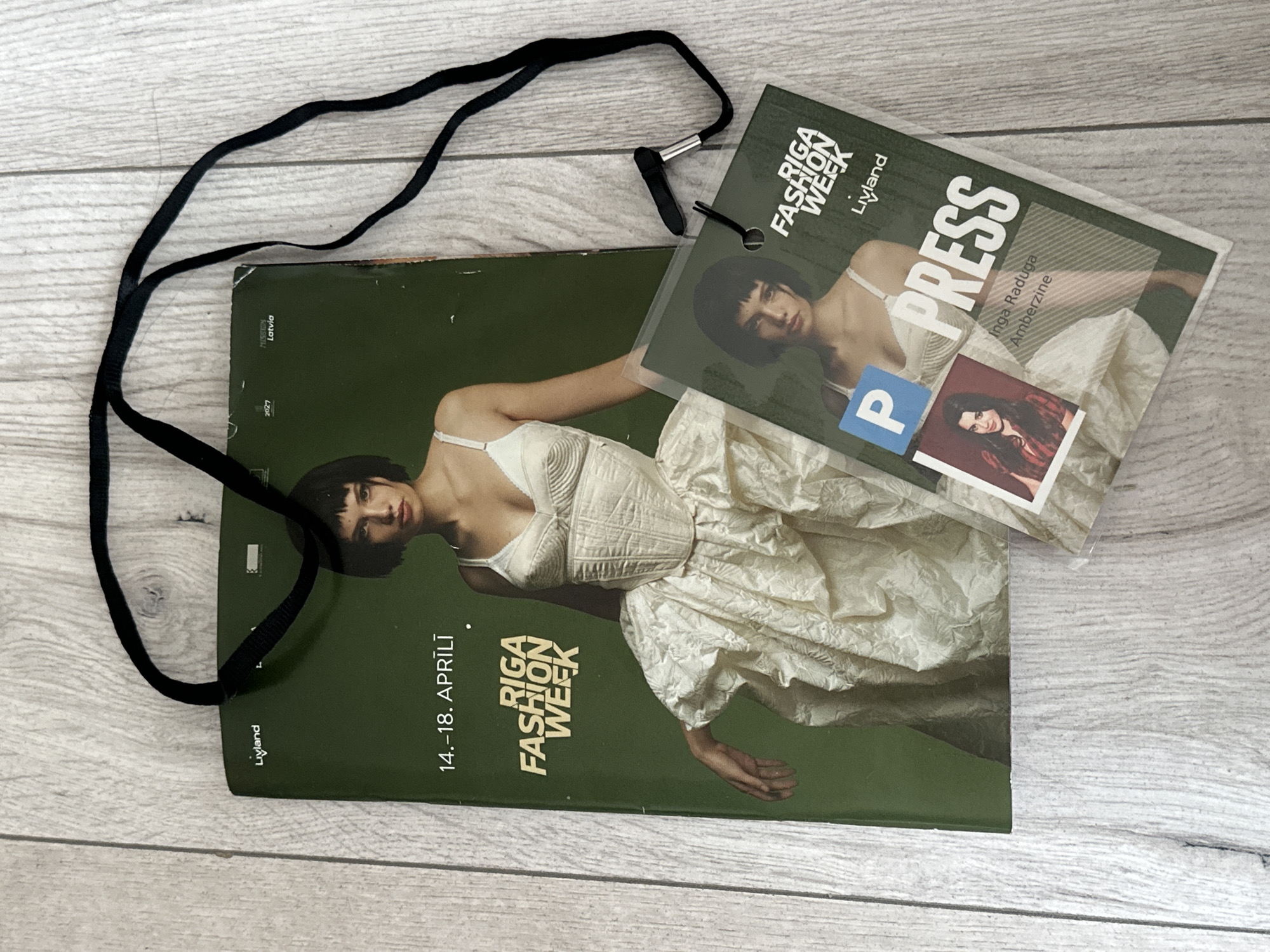 Riga Fashion Week press pass spotted on wooden surface