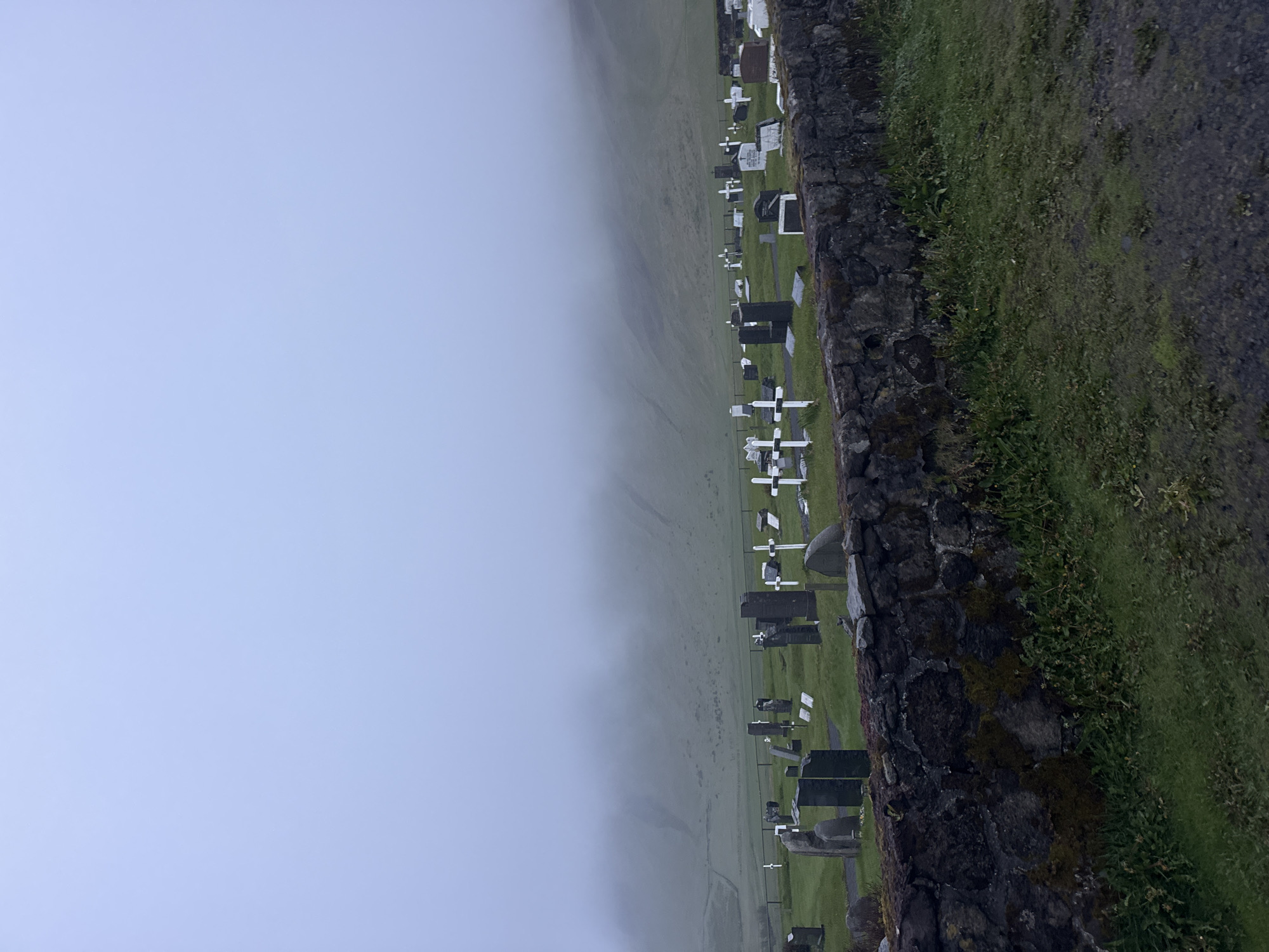Tourist documents foggy day exploring Vik Iceland village landmarks