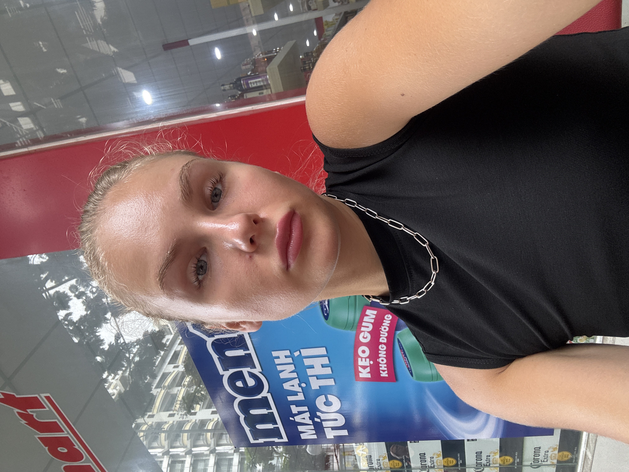 Storefront selfie on the streets of Nha Trang