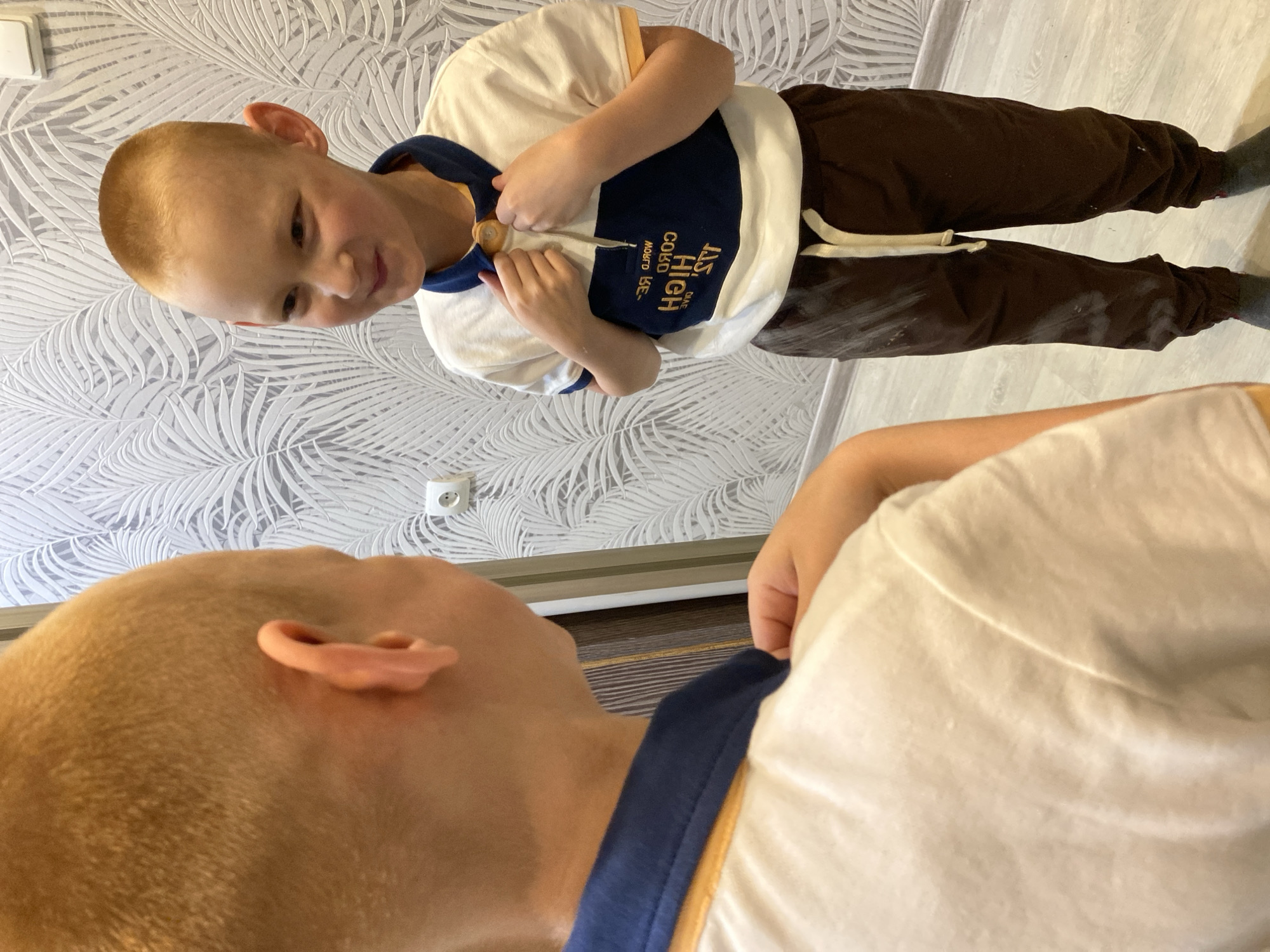 Mother and son share quiet moments in Noviy home