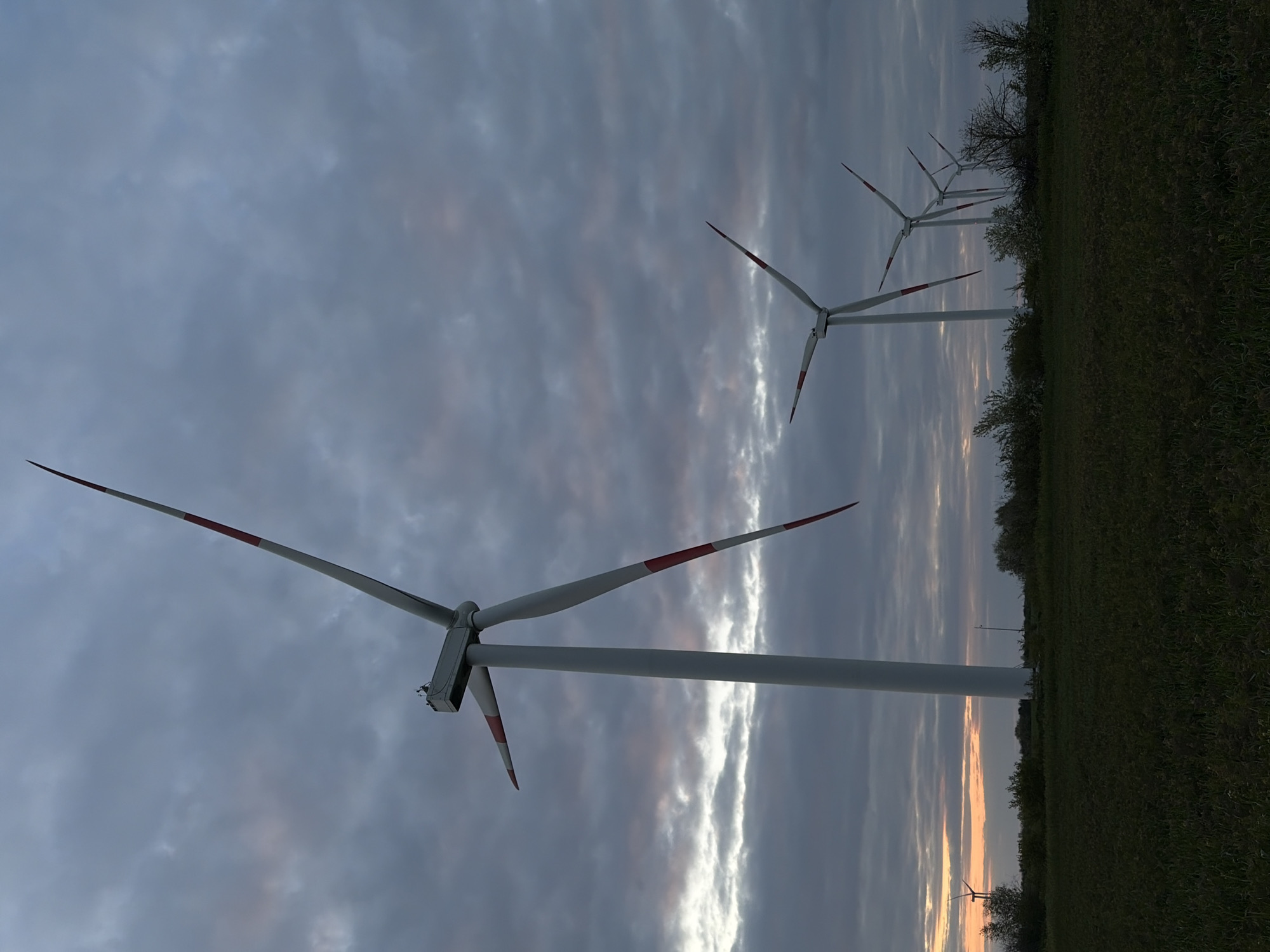 Wind turbines observed at dusk in Molchanovka, Russia