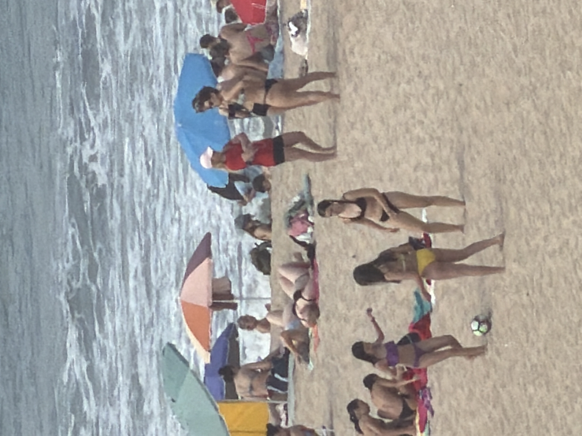 Crowded beach day captured at Espinho, Portugal coastline