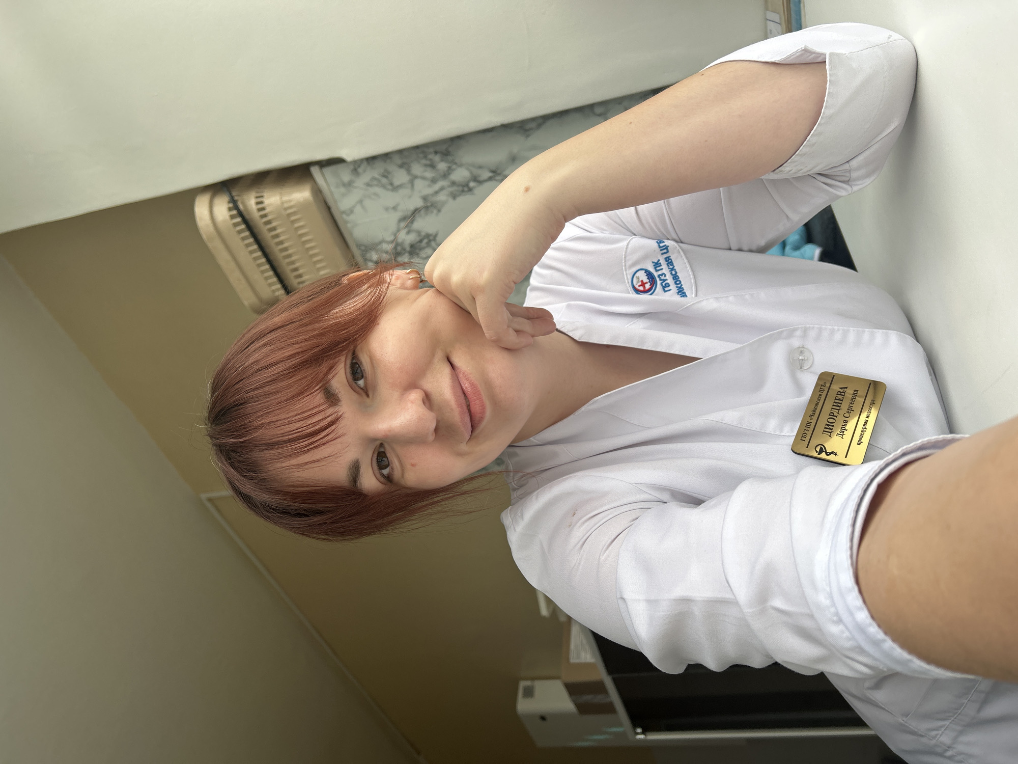 Lab-coated woman and vehicle interior observed in Foki, Russia