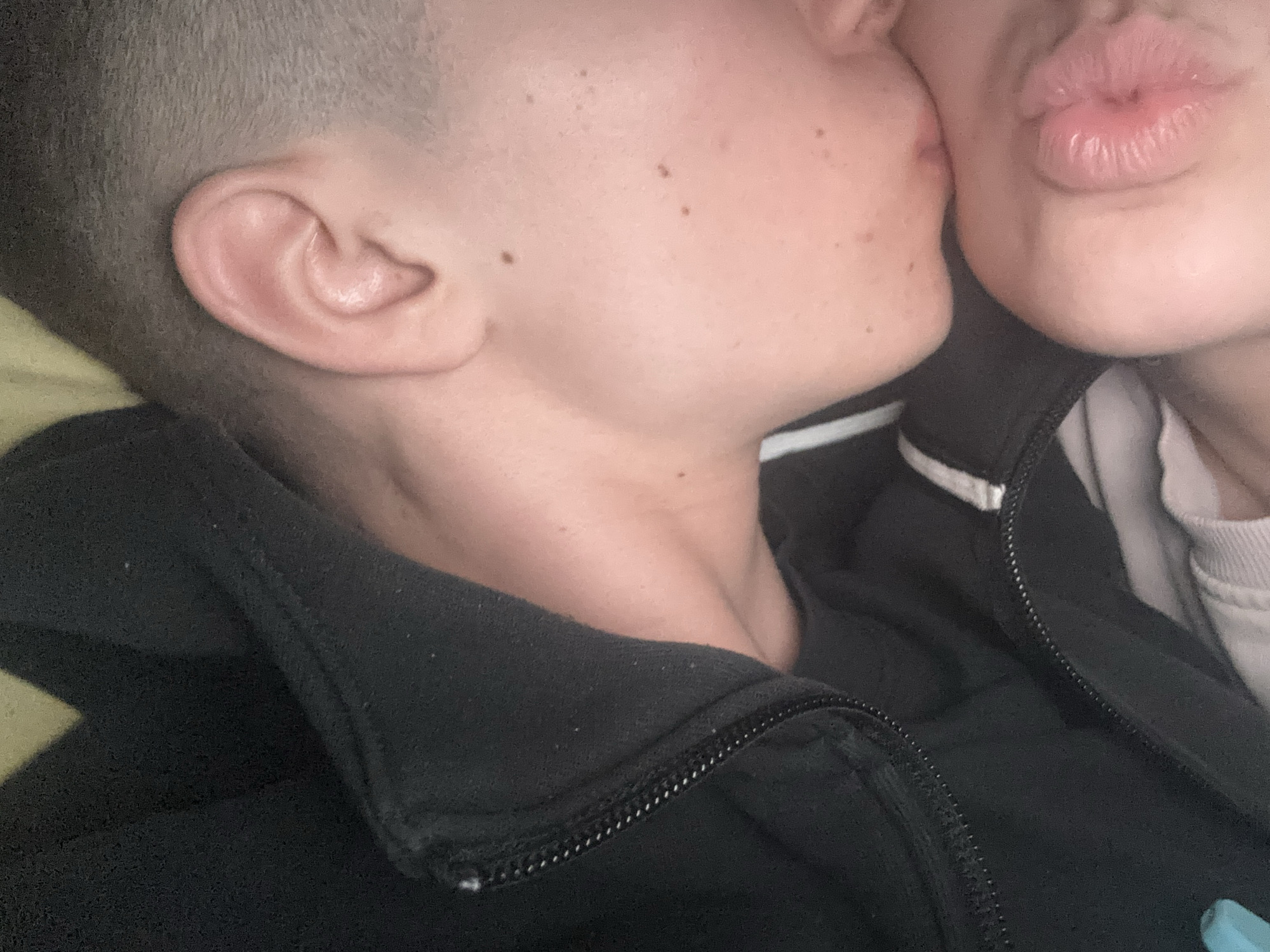 Intimate moment captured between two people in Bulgarian bedroom