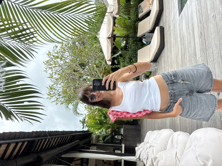 Woman takes mirror selfie at Canggu resort villa
