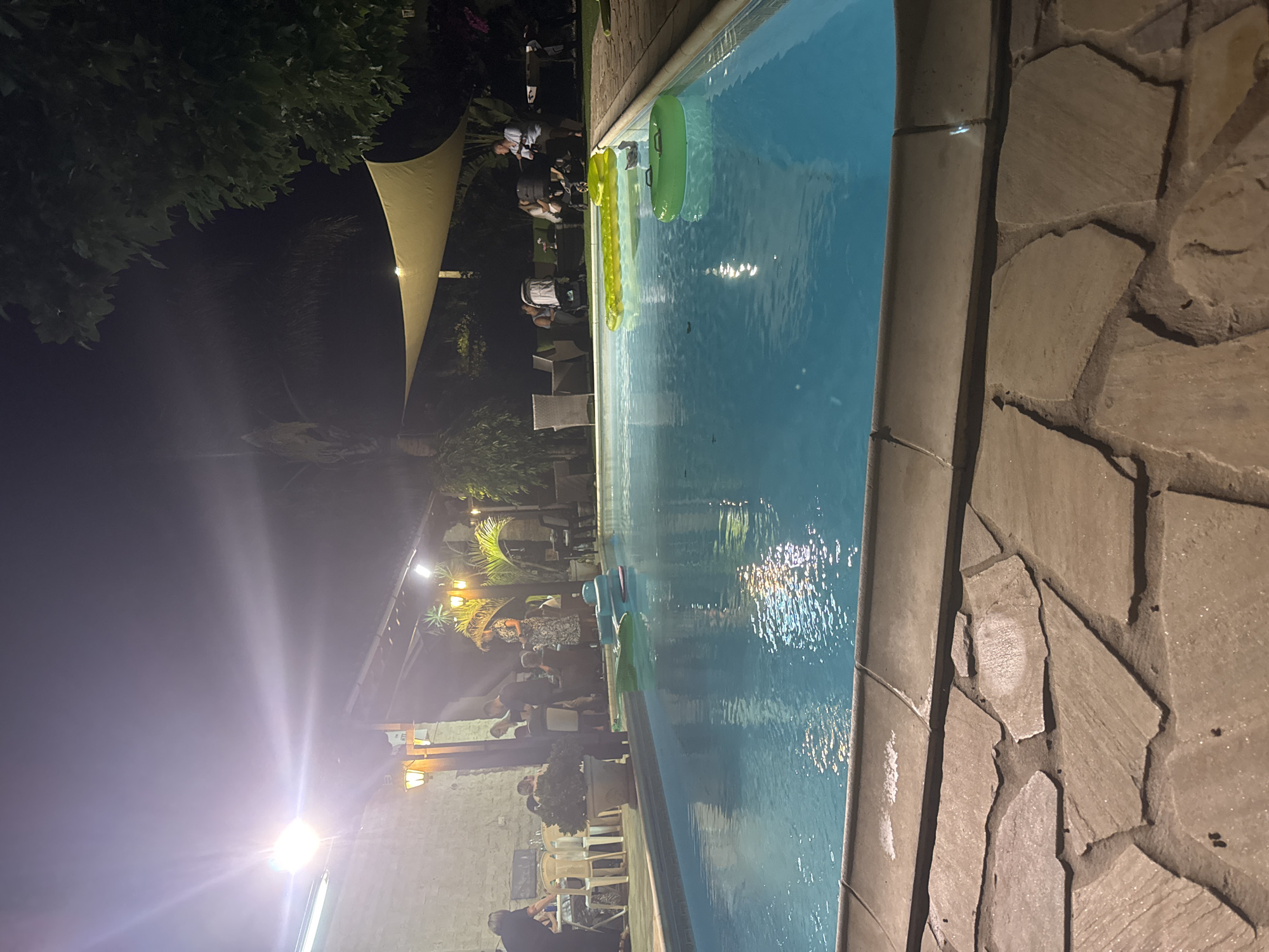 Nighttime pool scene glowing under lights in Pervolia, Cyprus