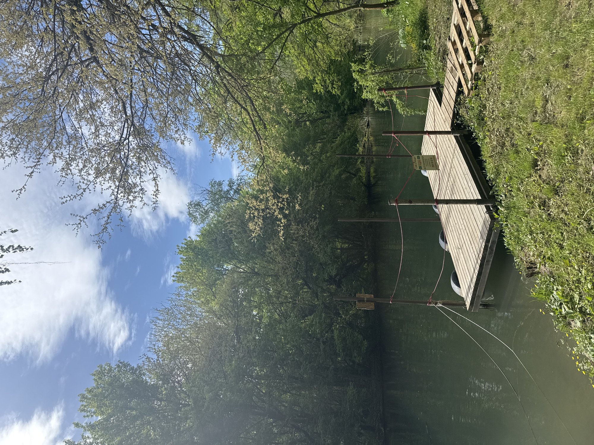 Wooden dock with metal poles observed over water in Lukovit