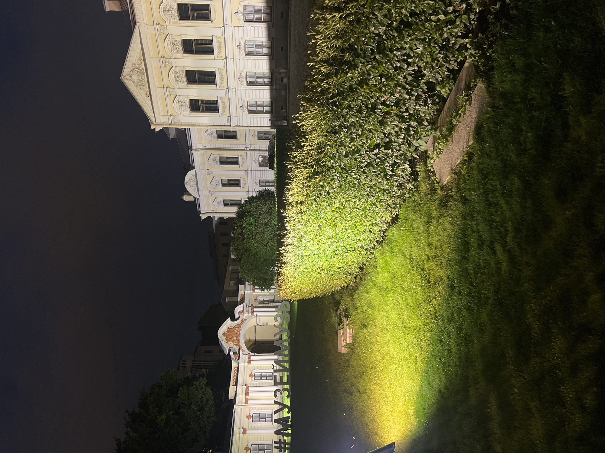 Nighttime views of a lit neoclassical museum complex in Saint Petersburg