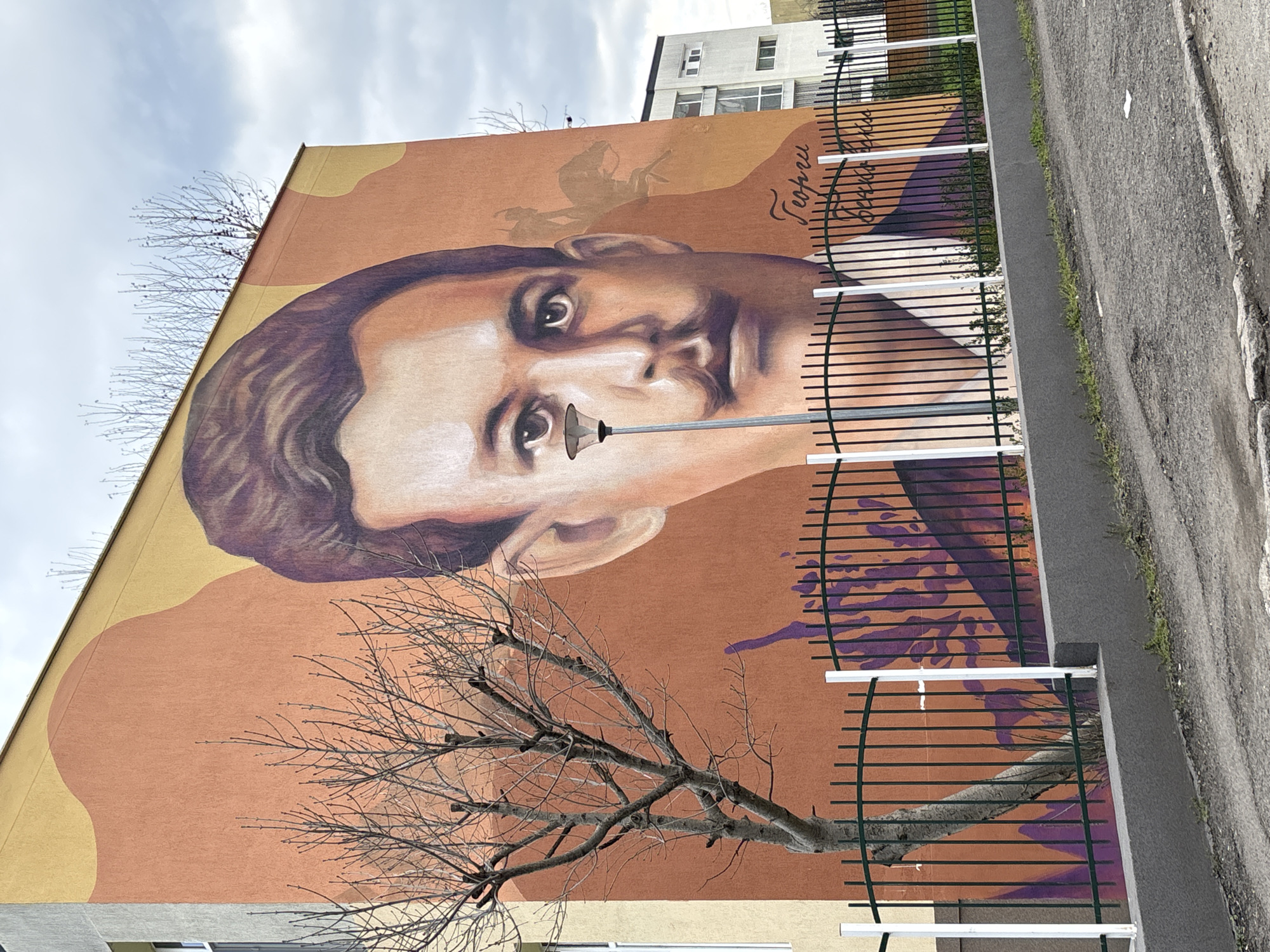 Casual moments captured in Burgas: historic mural, sleeping dogs