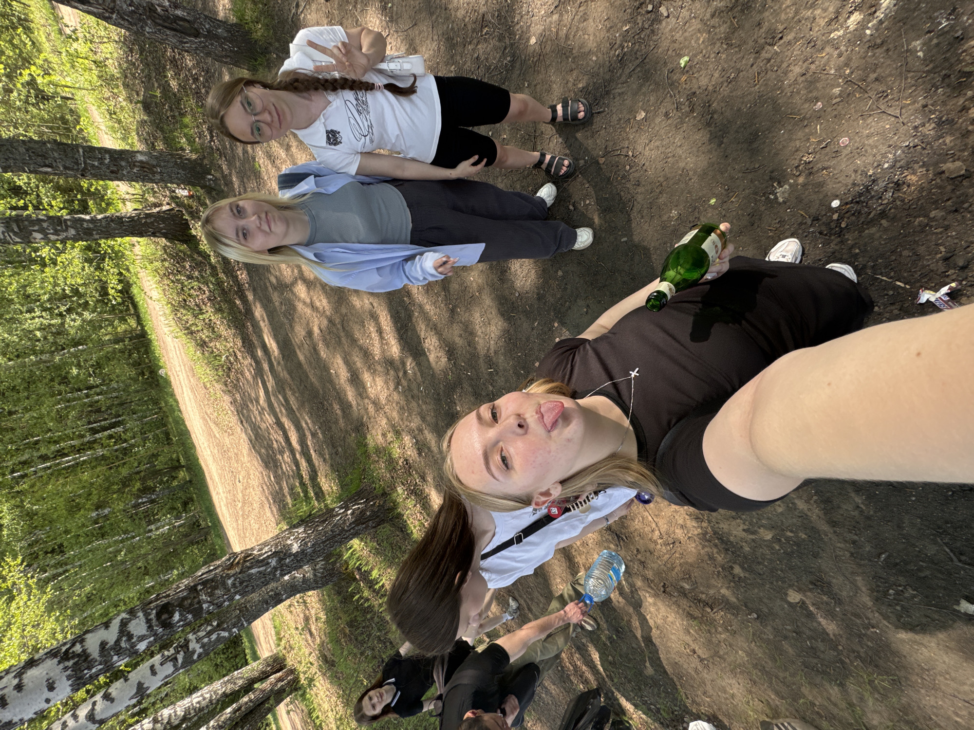 Young women enjoy morning picnic by Perm riverbank