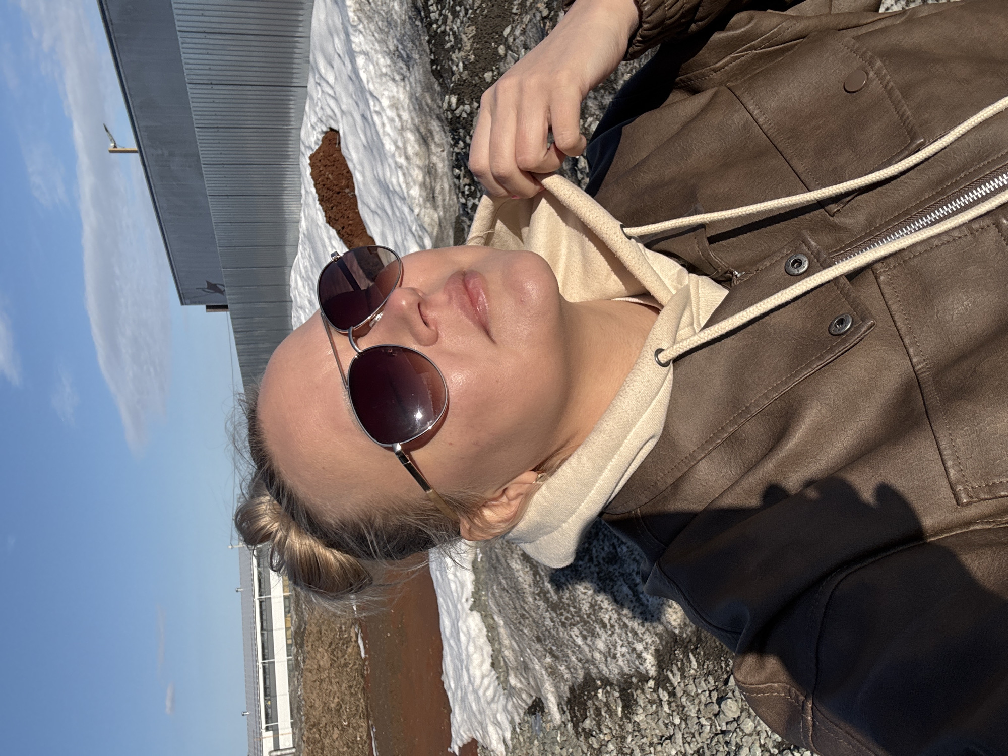 Woman lies on snowy ground in Izhevsk