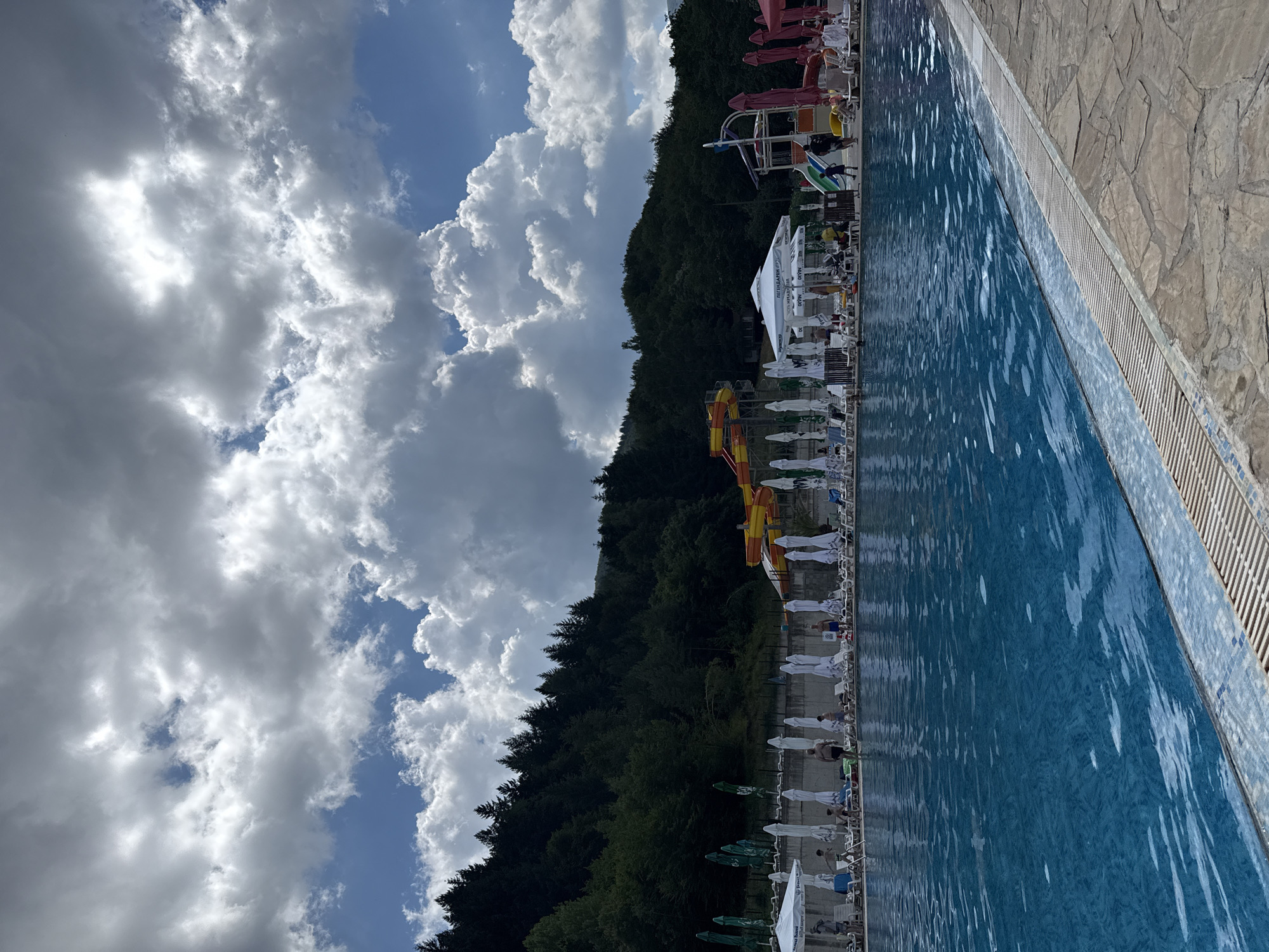 Busy summer afternoon at a Bulgarian resort pool