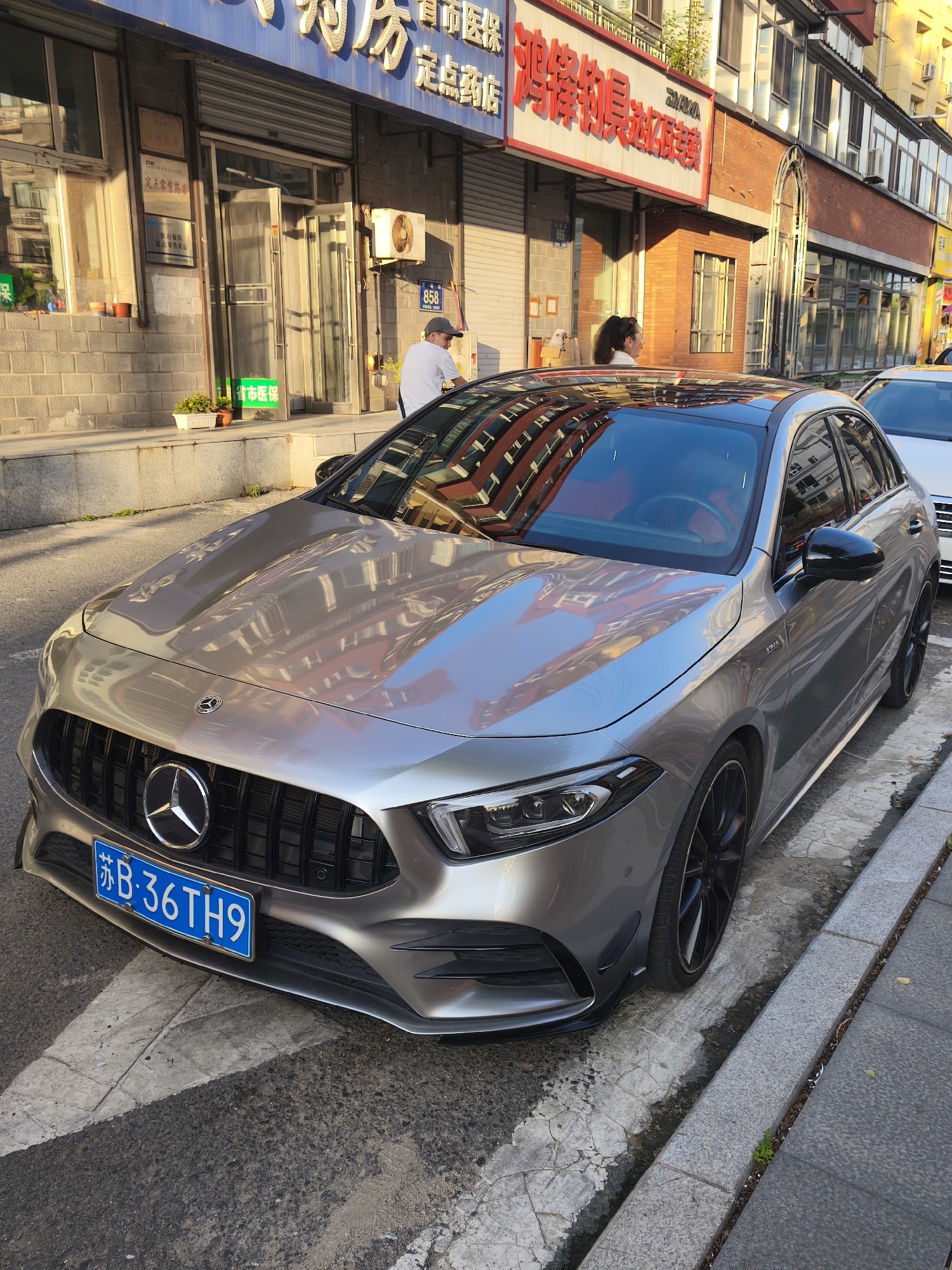 Changchun streets: traffic, parked cars, and urban greenery