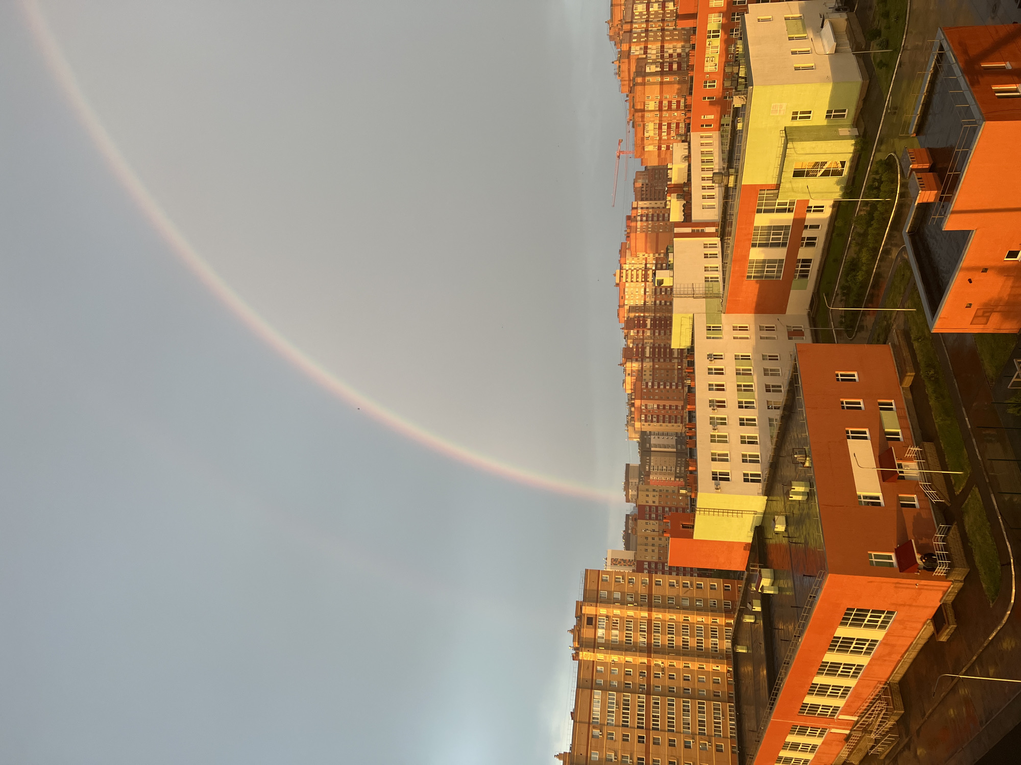 Rainbow appears over Ufa, Russia during golden hour