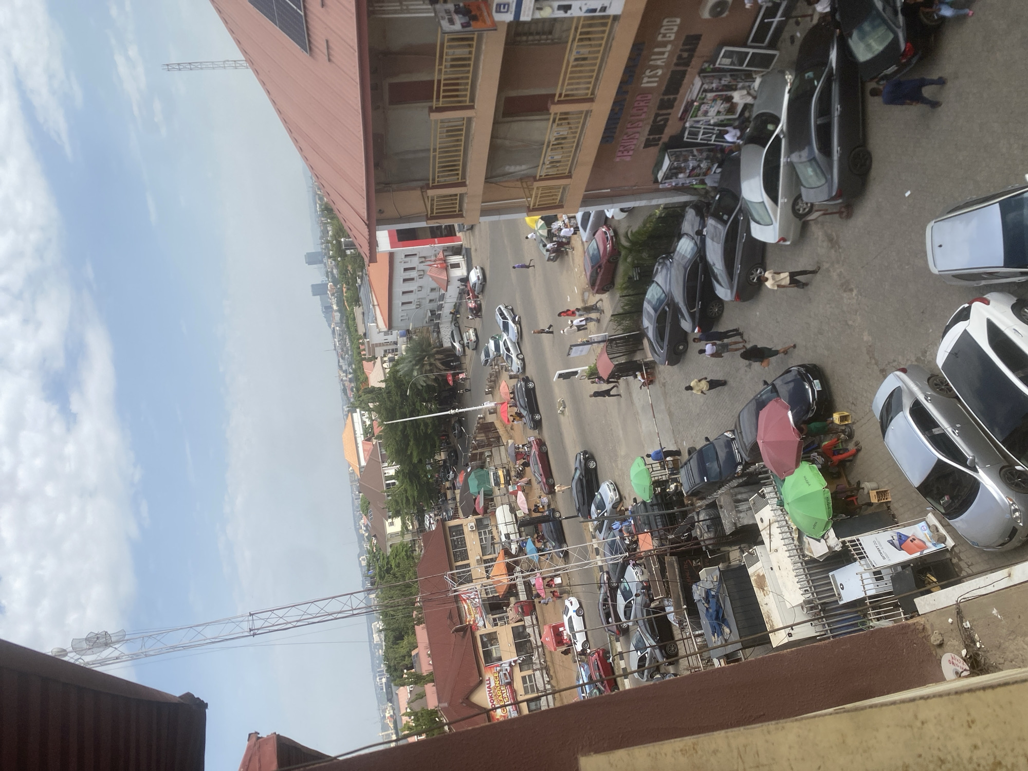 Busy street activity captured in commercial Abuja district