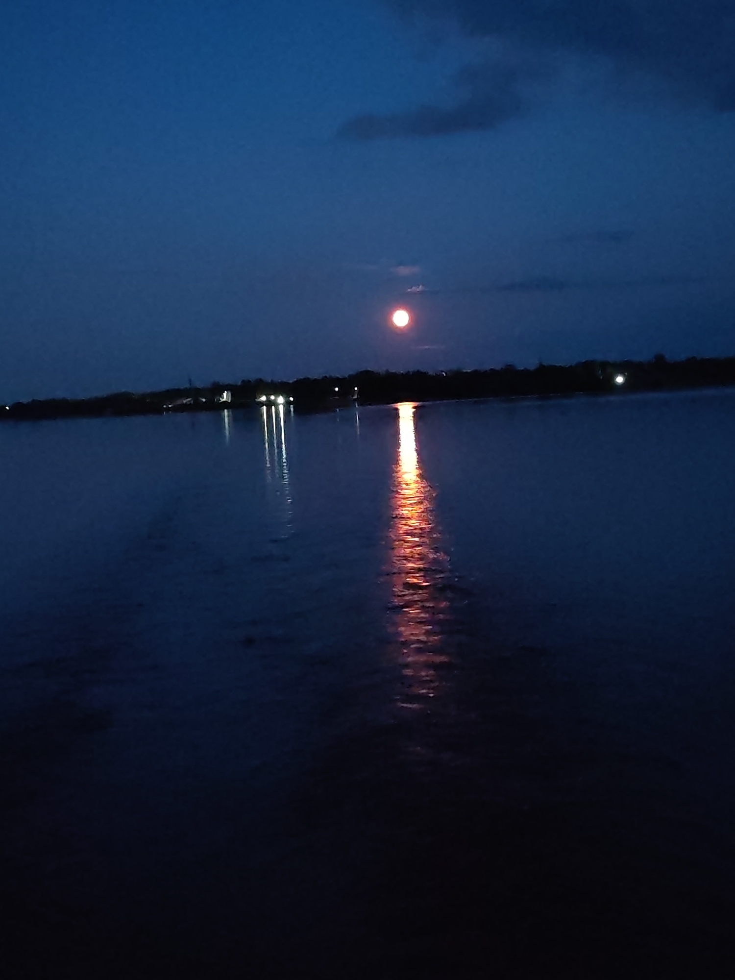 Moonlit river evening with stormy skies near Bol'shie Mkhi