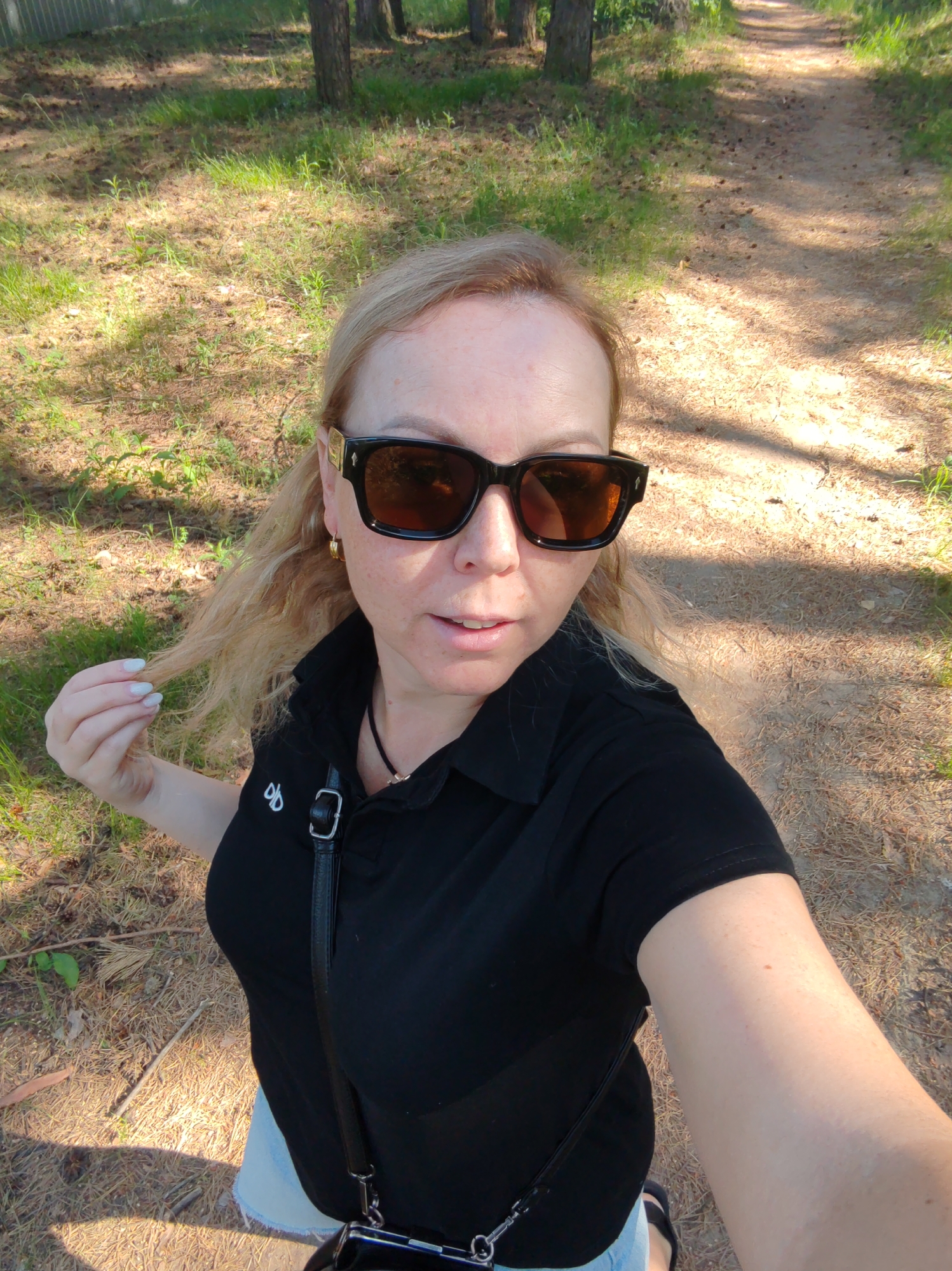 Woman Takes Morning Selfie on Forest Path in Russia