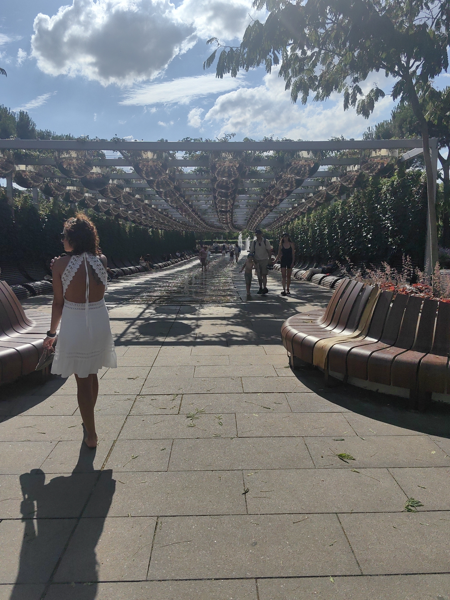 Afternoon in a Krasnodar park — fountains, hedges, and open walkways