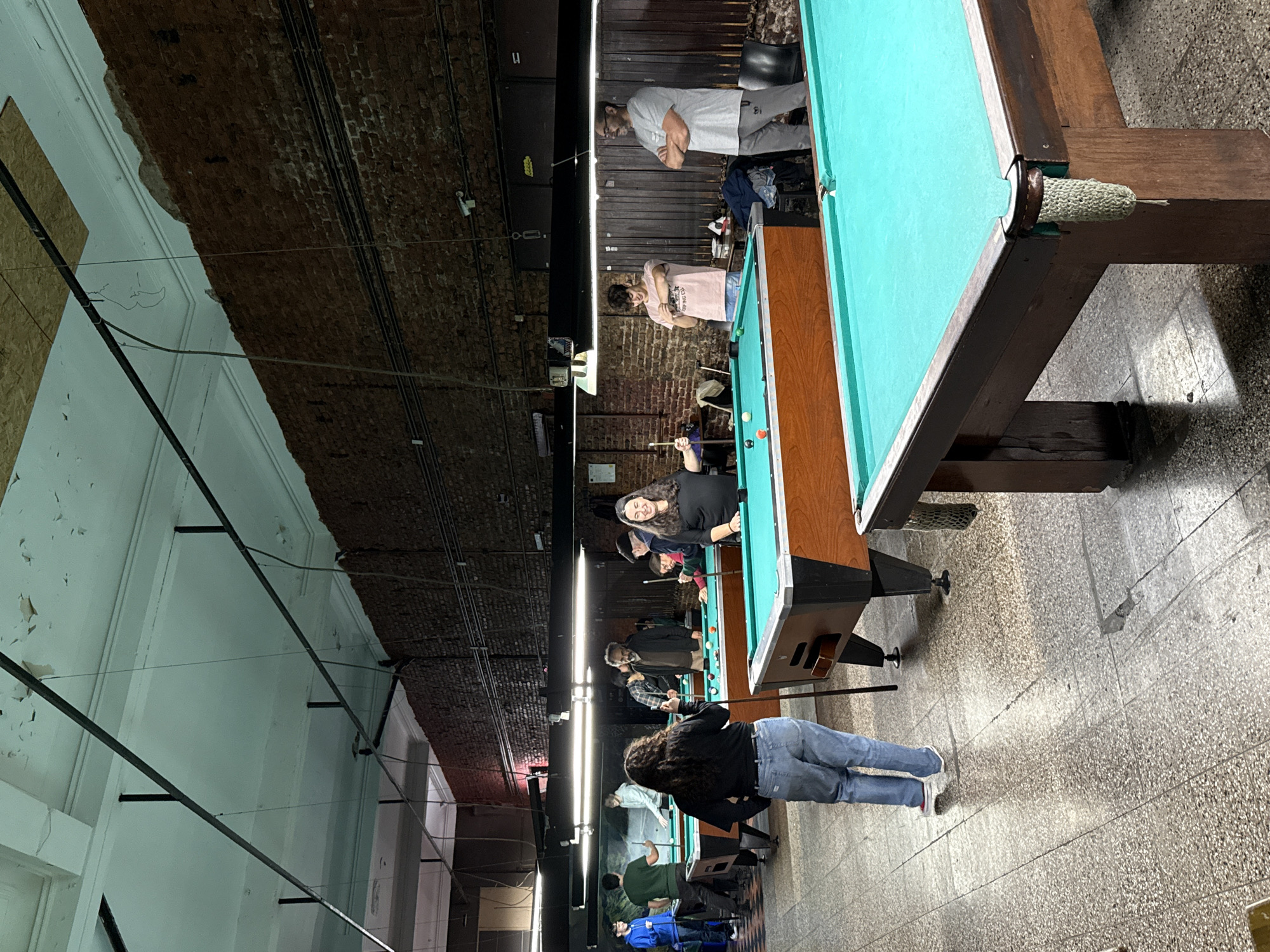 Evening billiards session draws players to Buenos Aires pool hall