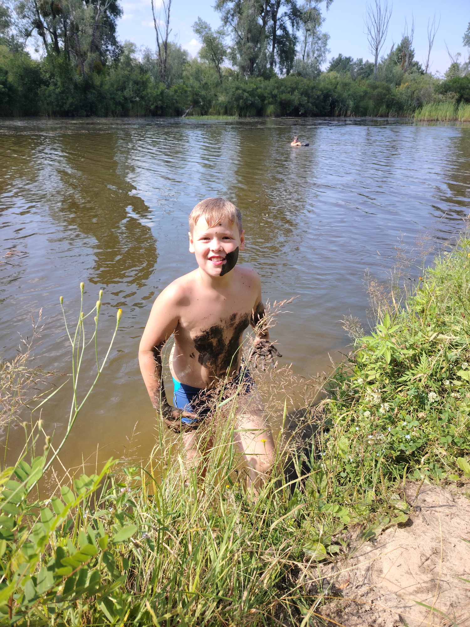 Summer swimming and fishing on a Ukrainian riverside