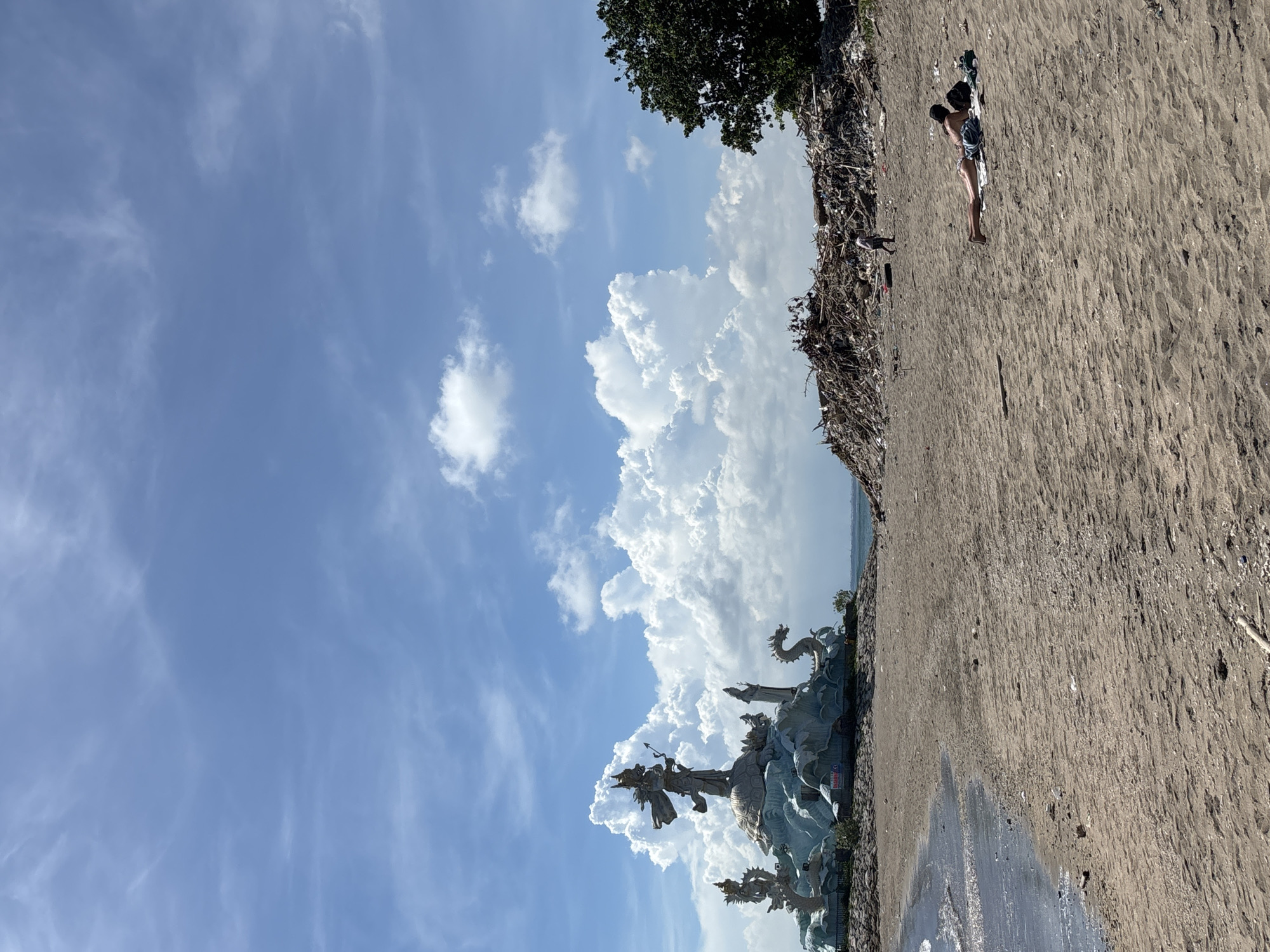 Kite flying observed near Arjuna statue on Kuta beach