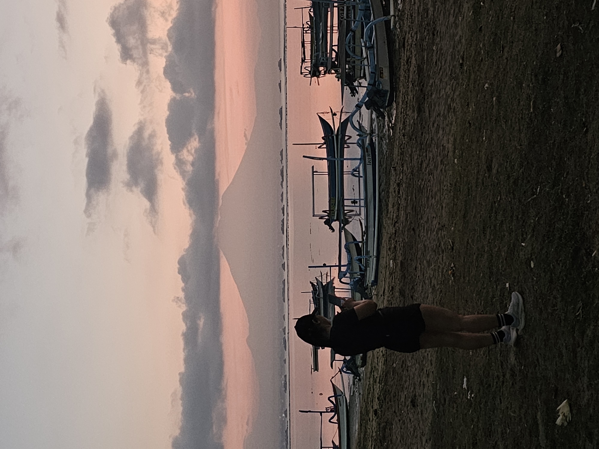 Twilight at the Denpasar coast with Mount Agung on the horizon