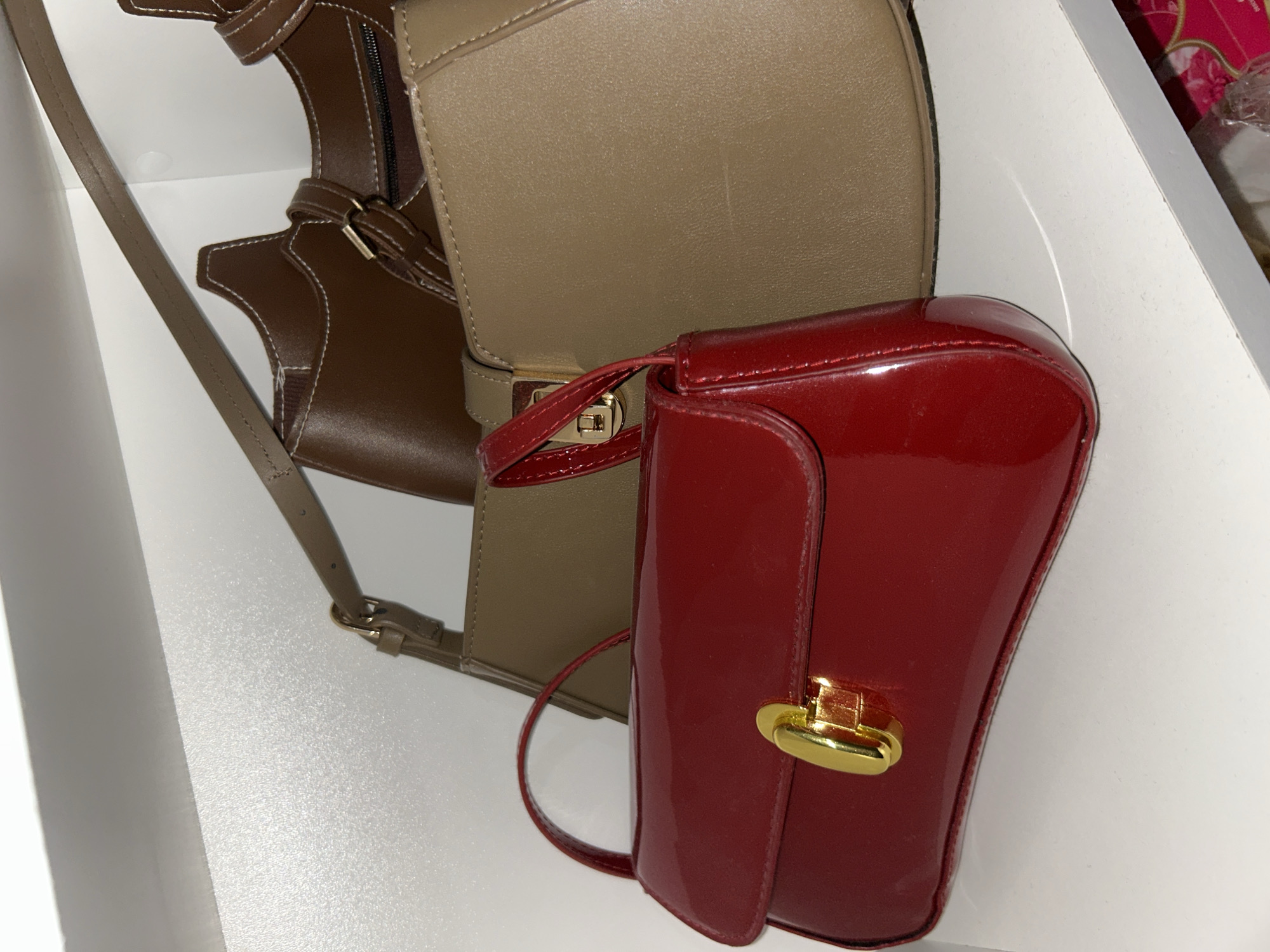 Two handbags spotted on white shelf in Pleven
