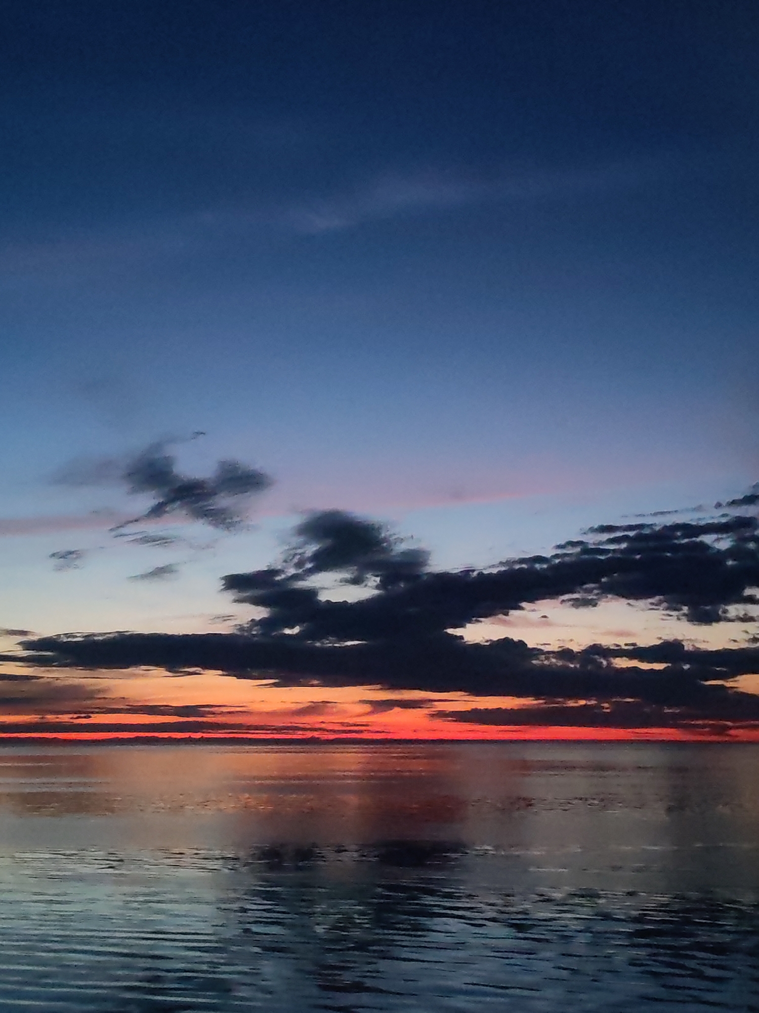 Dramatic sunset observed over water in Mologa, Russia