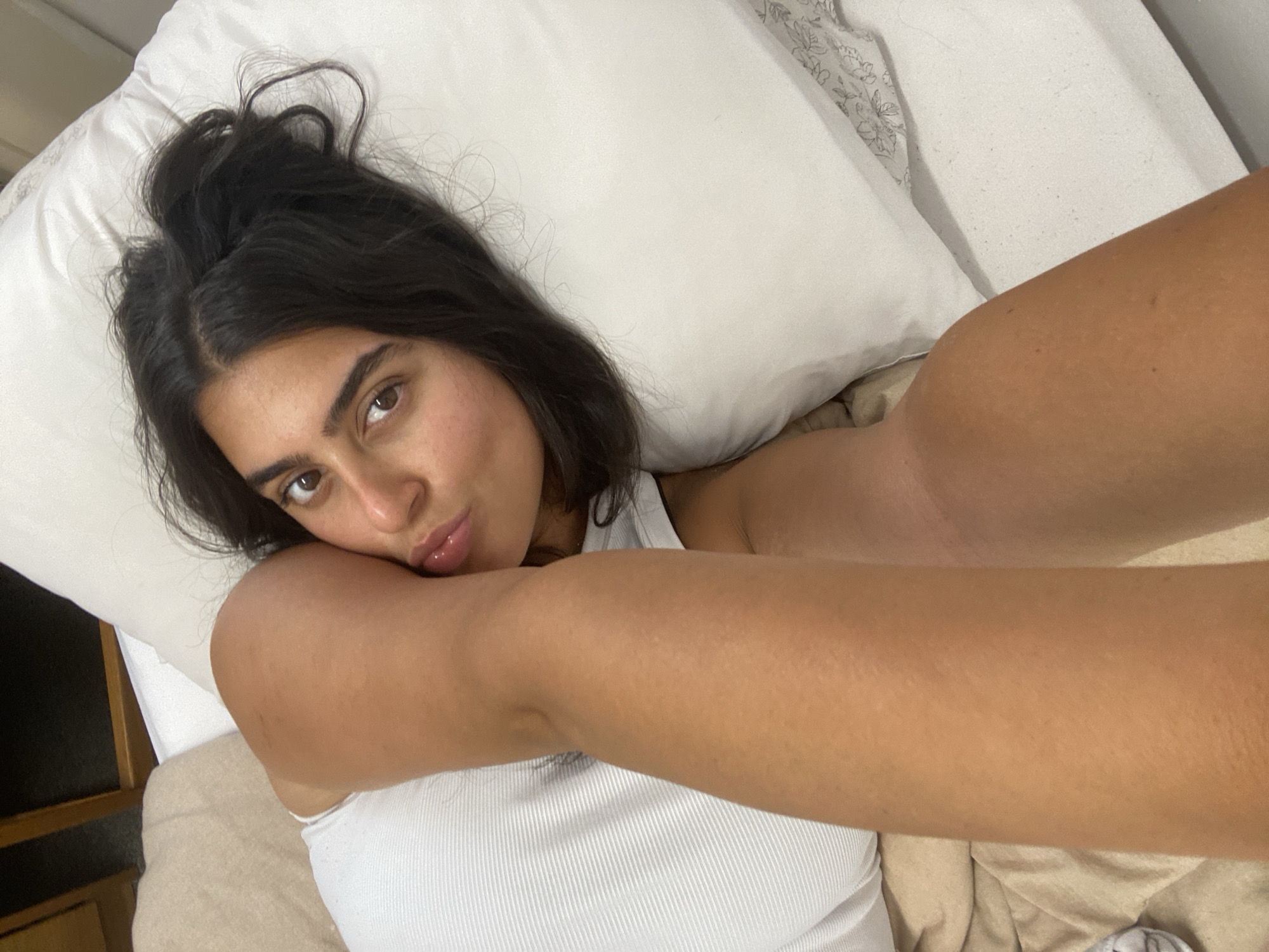 Woman photographed in bedroom portrait session in New York