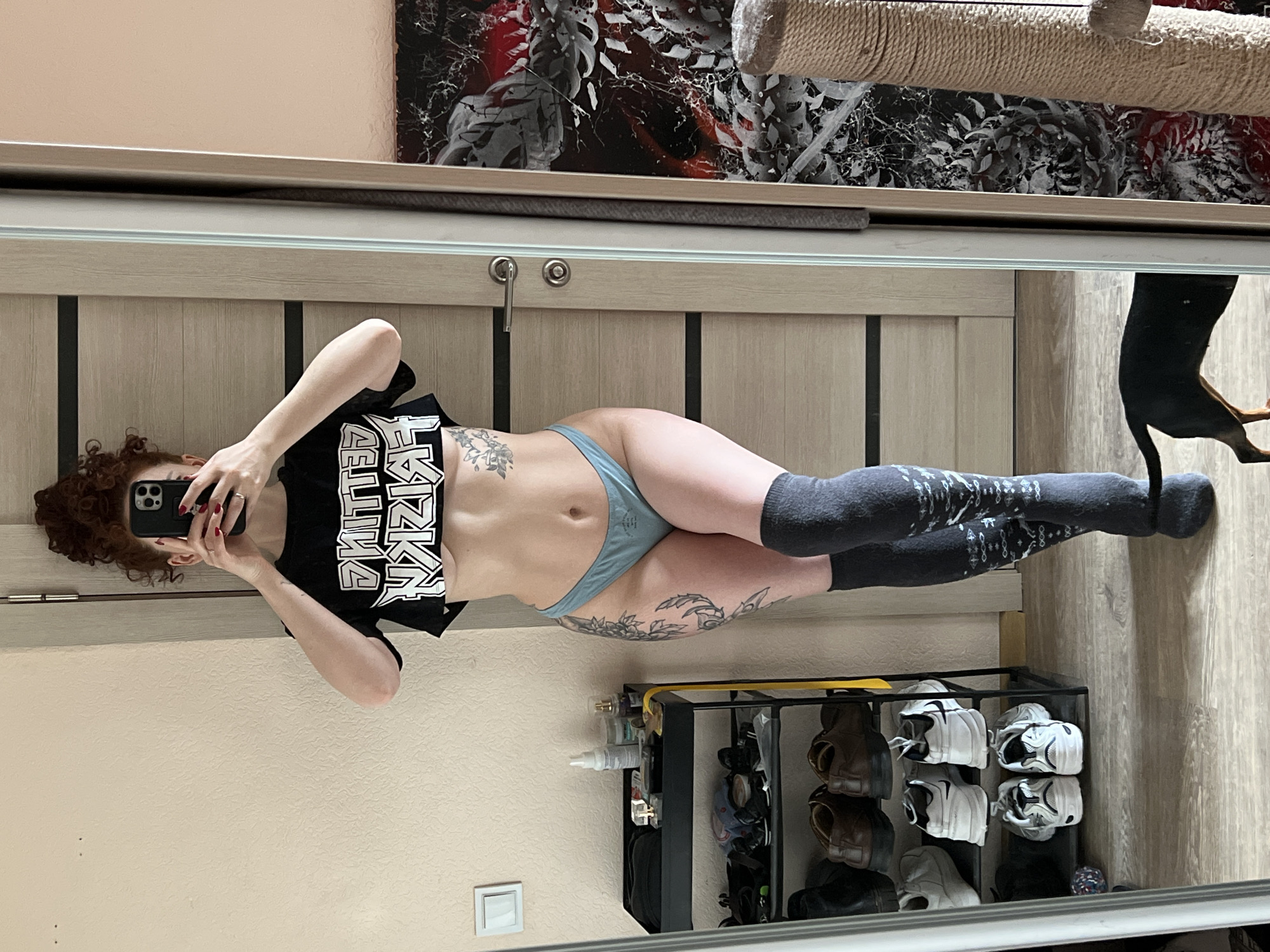 Woman takes mirror selfie in Saint Petersburg apartment
