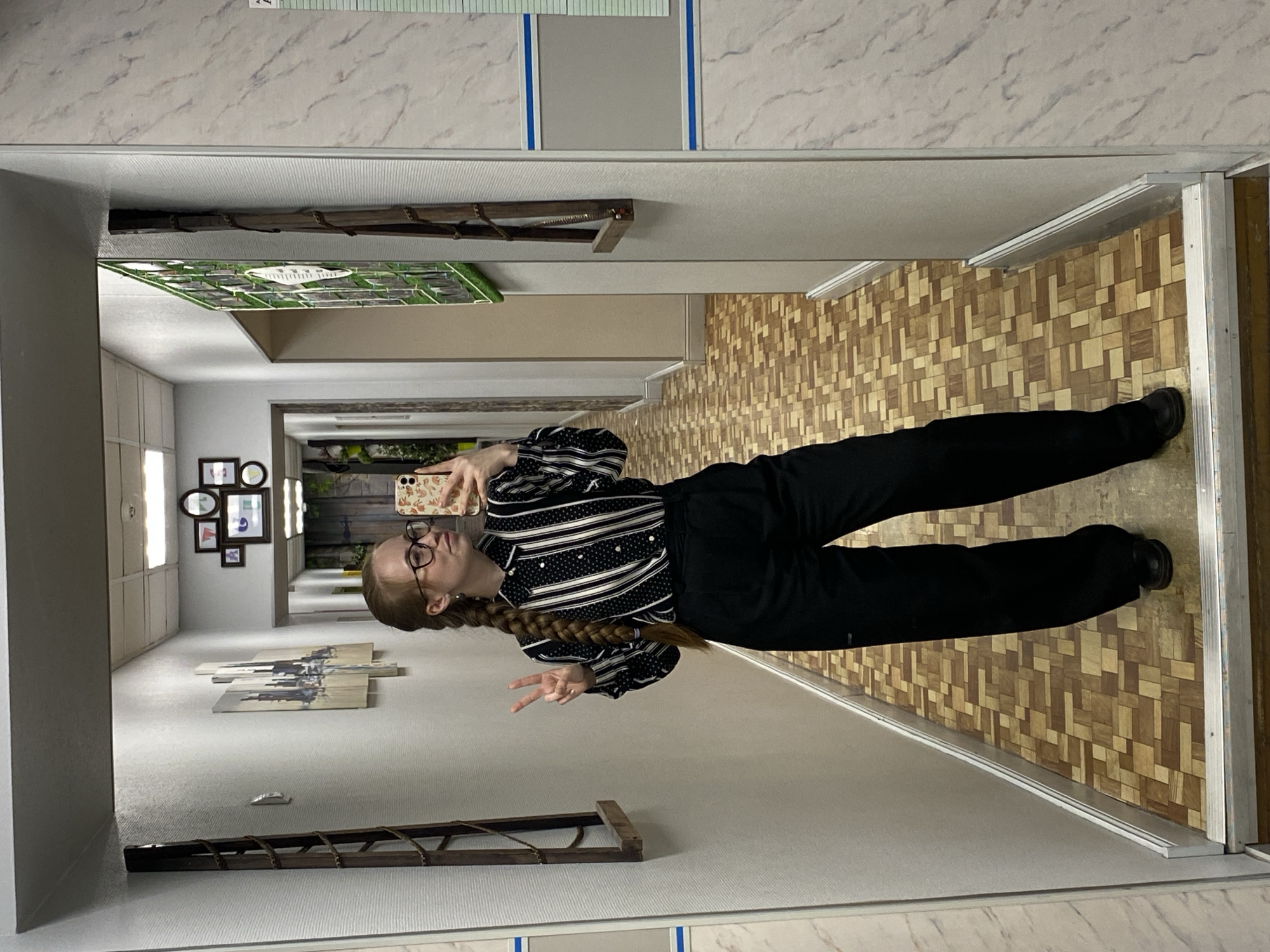 Student with schedule walks through Saint Petersburg school hallway