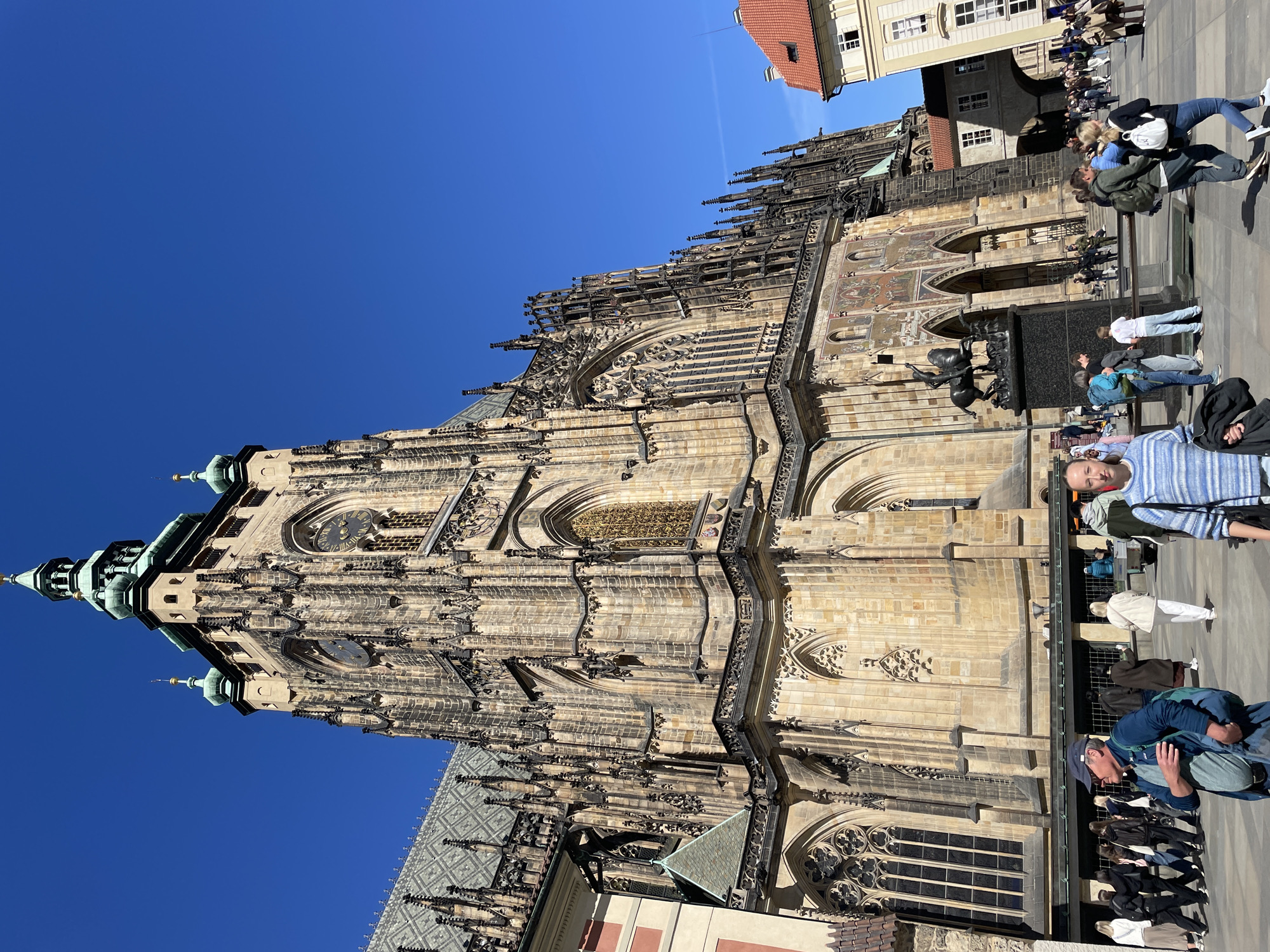 Prague street scene captured with historic plague column