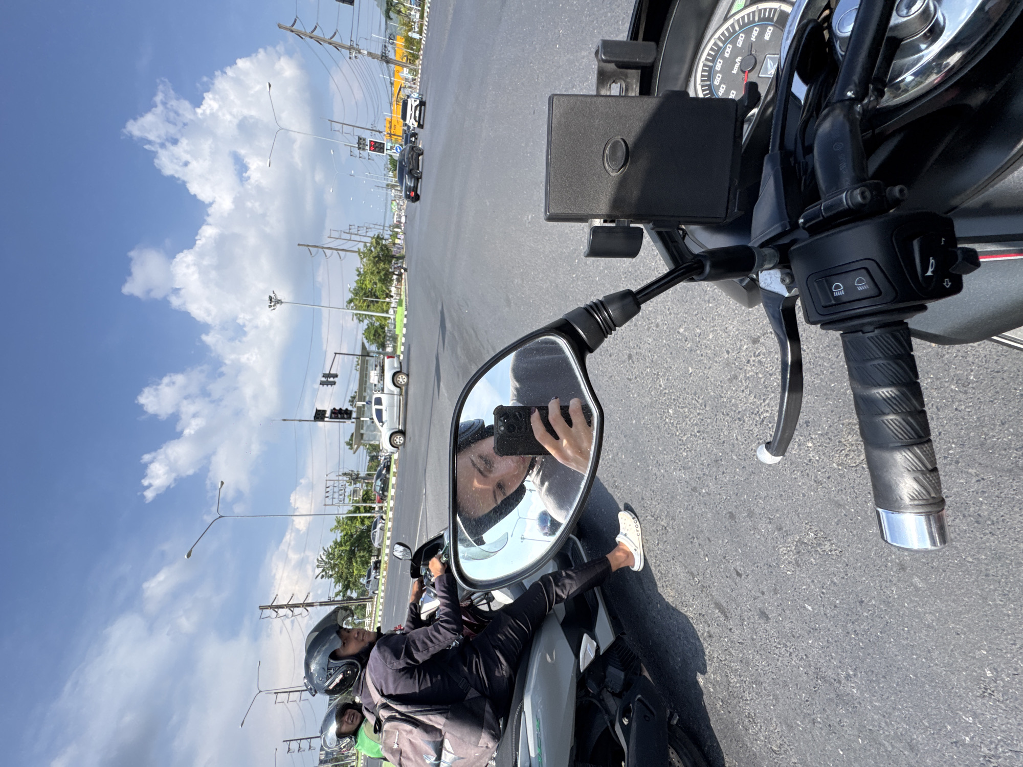 Motorcycle rider documents journey through Ratsada, Thailand with selfies