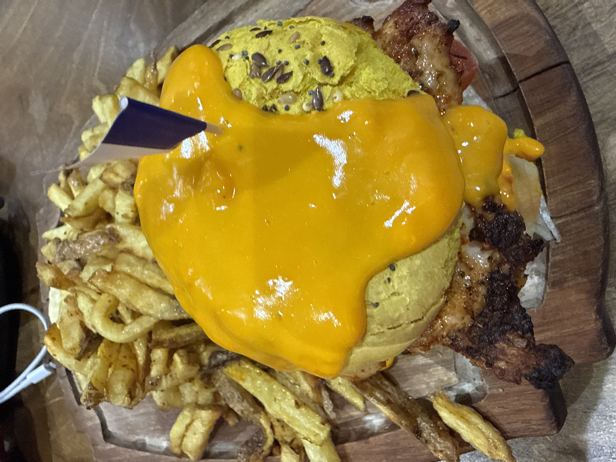 Burger with yellow sauce photographed in Paris