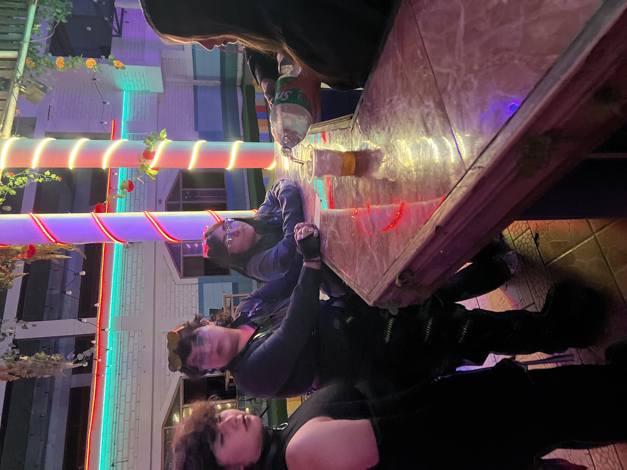 Late-night DJ event at a lit-up Arica venue