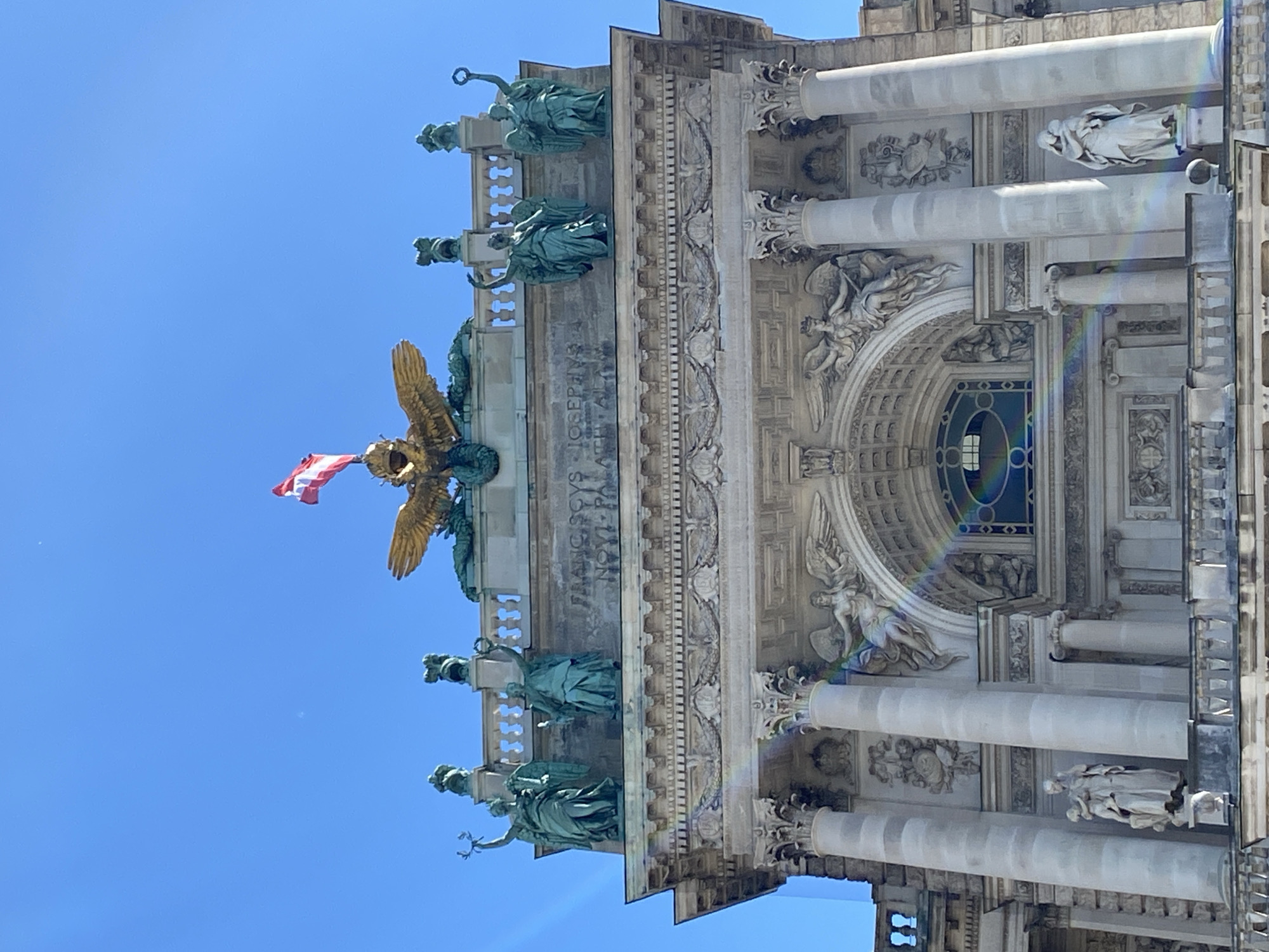Tourist documents Hofburg Palace architecture during Vienna visit