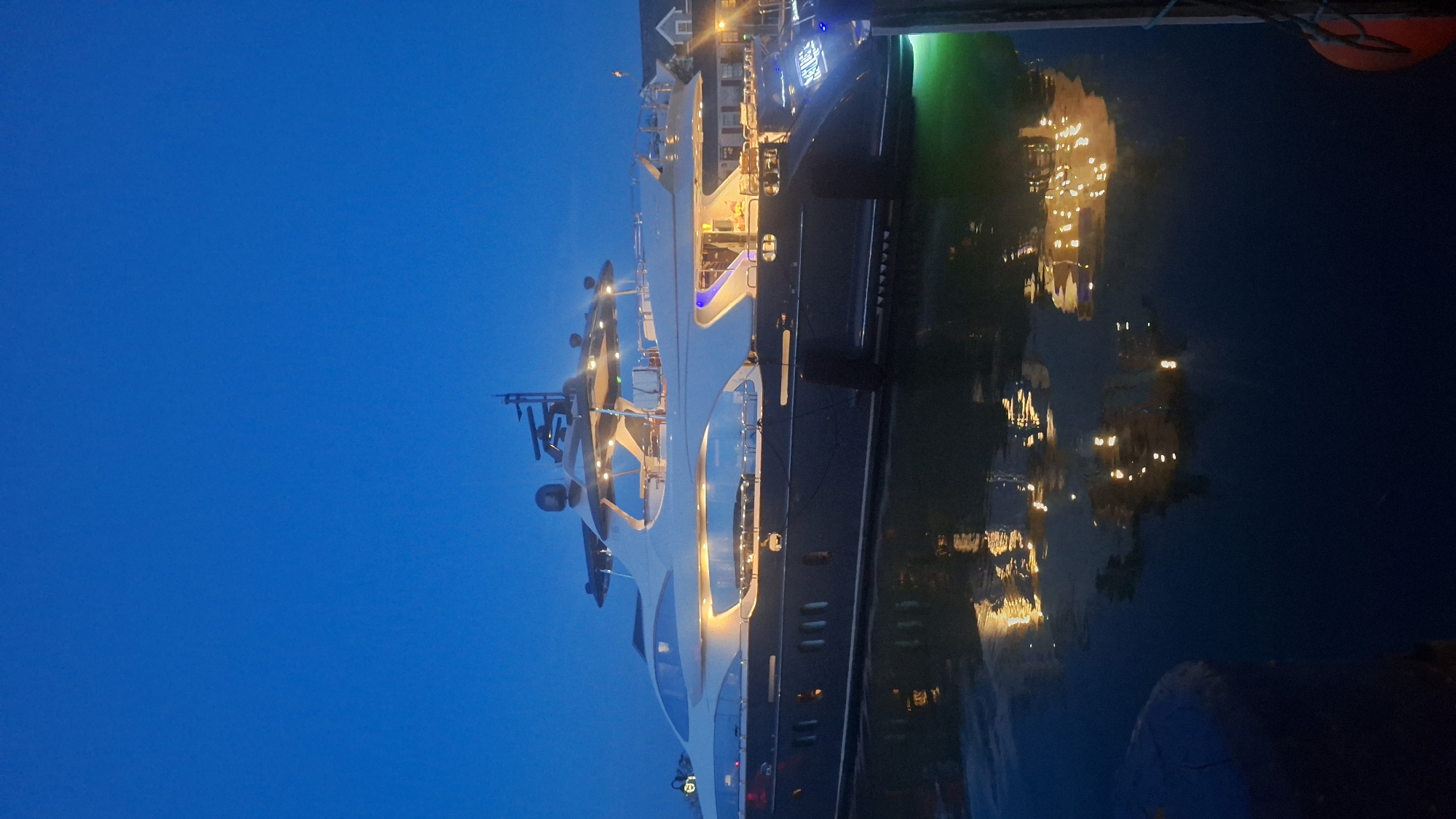 Nantucket harbor fills with yachts as night falls